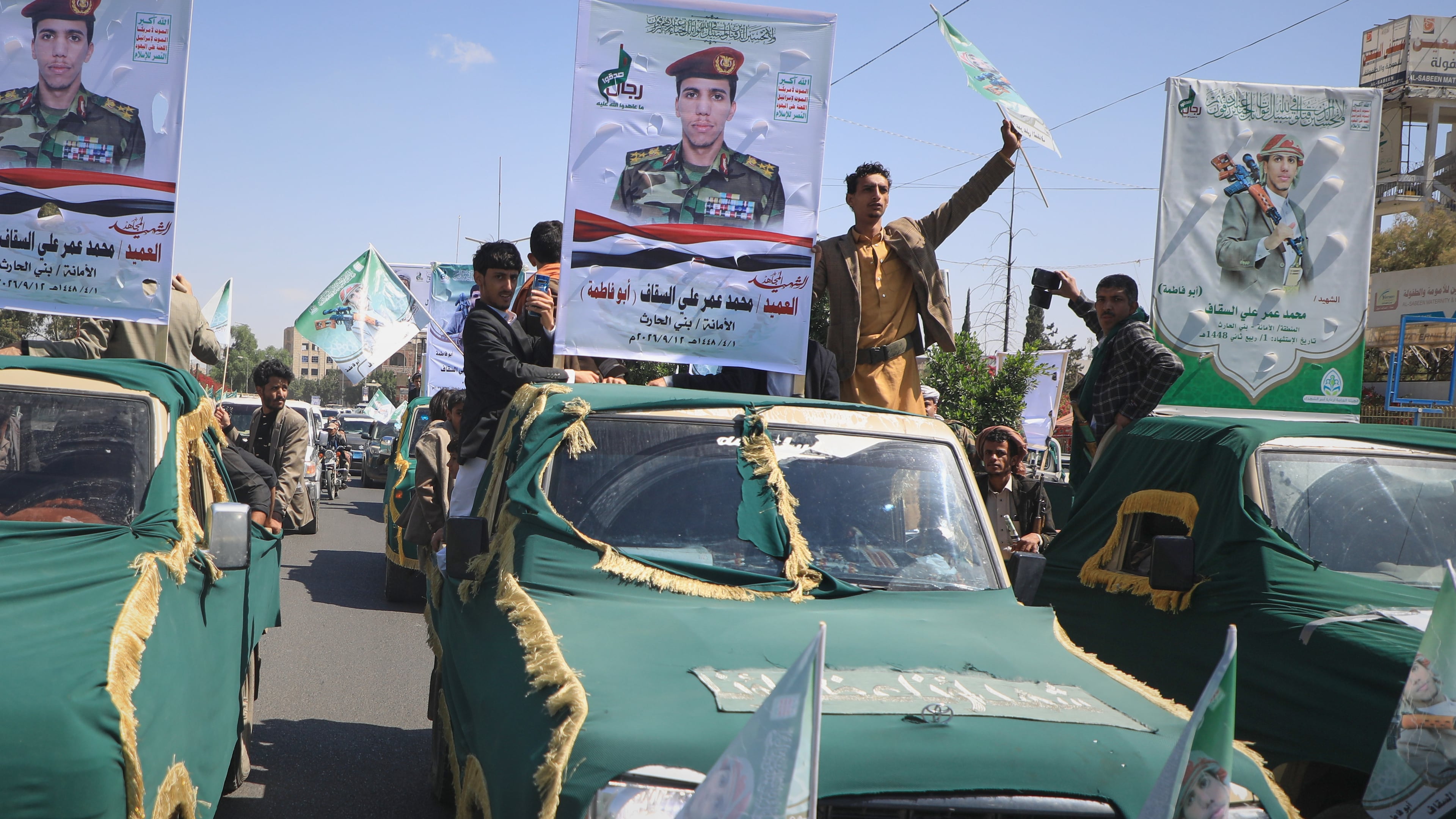 Pickup trucks travel in a mass funeral procession for Houthi officers and other military personnel in Sanaa, Yemen, Wednesday, Sept. 16, 2026. (AP Photo)