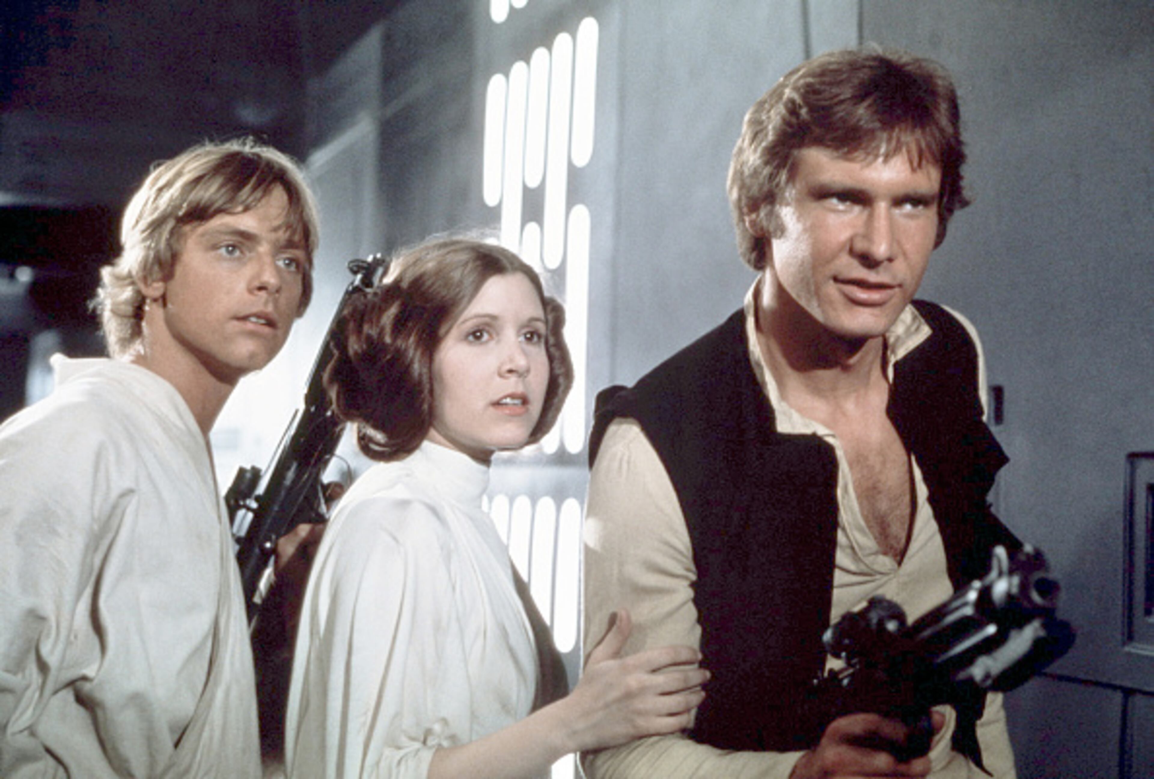 American actors Mark Hamill, Carrie Fisher and Harrison Ford on the set of Star Wars: Episode IV - A New Hope written, directed and produced by Georges Lucas. (Photo by Sunset Boulevard/Corbis via Getty Images)