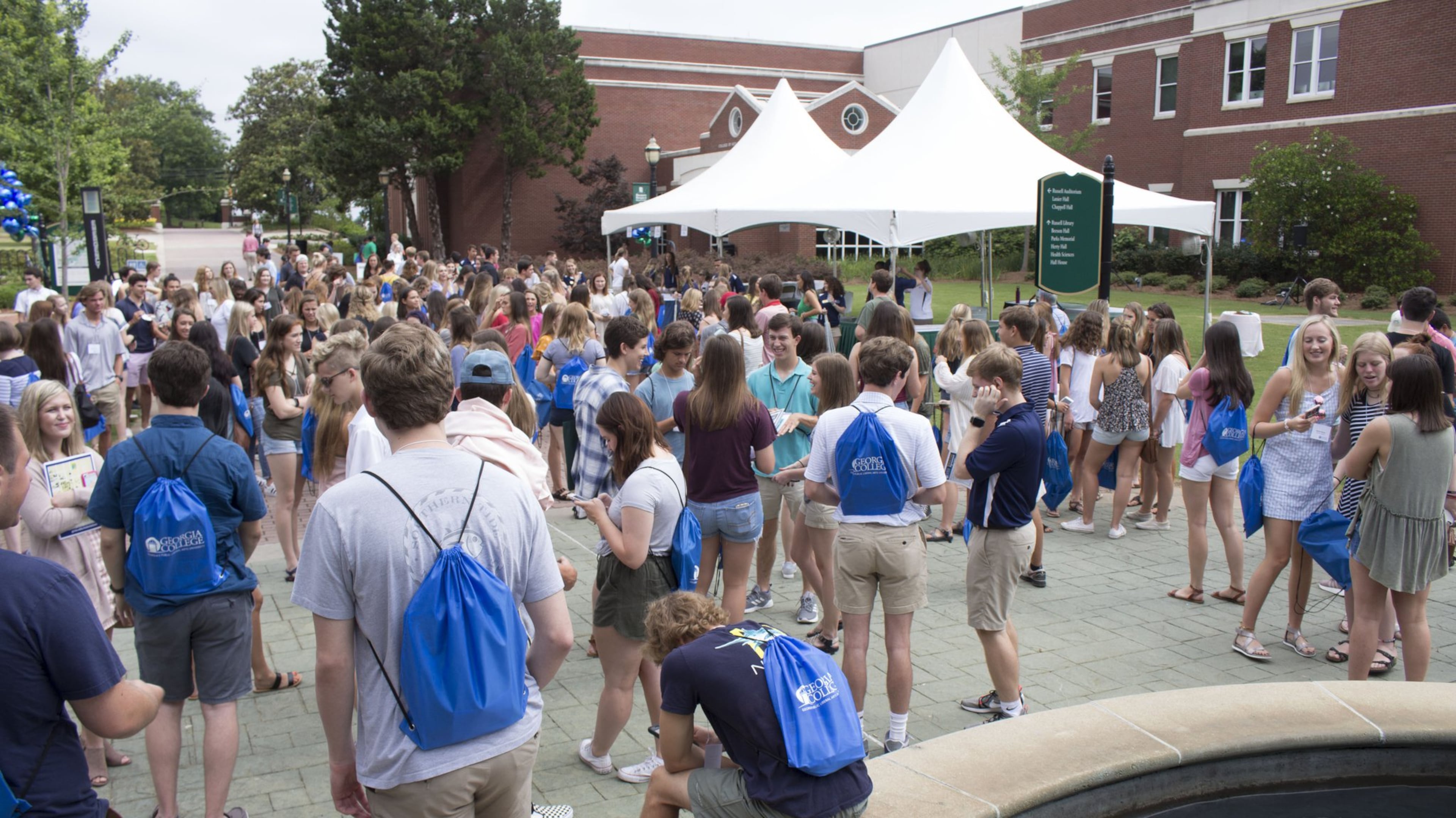 Students and parents gather around the fountain at Georgia College, which hosted its second freshmen orientation out of five for the summer on Friday, June 15. Jenna Eason / Jenna.Eason@coxinc.com