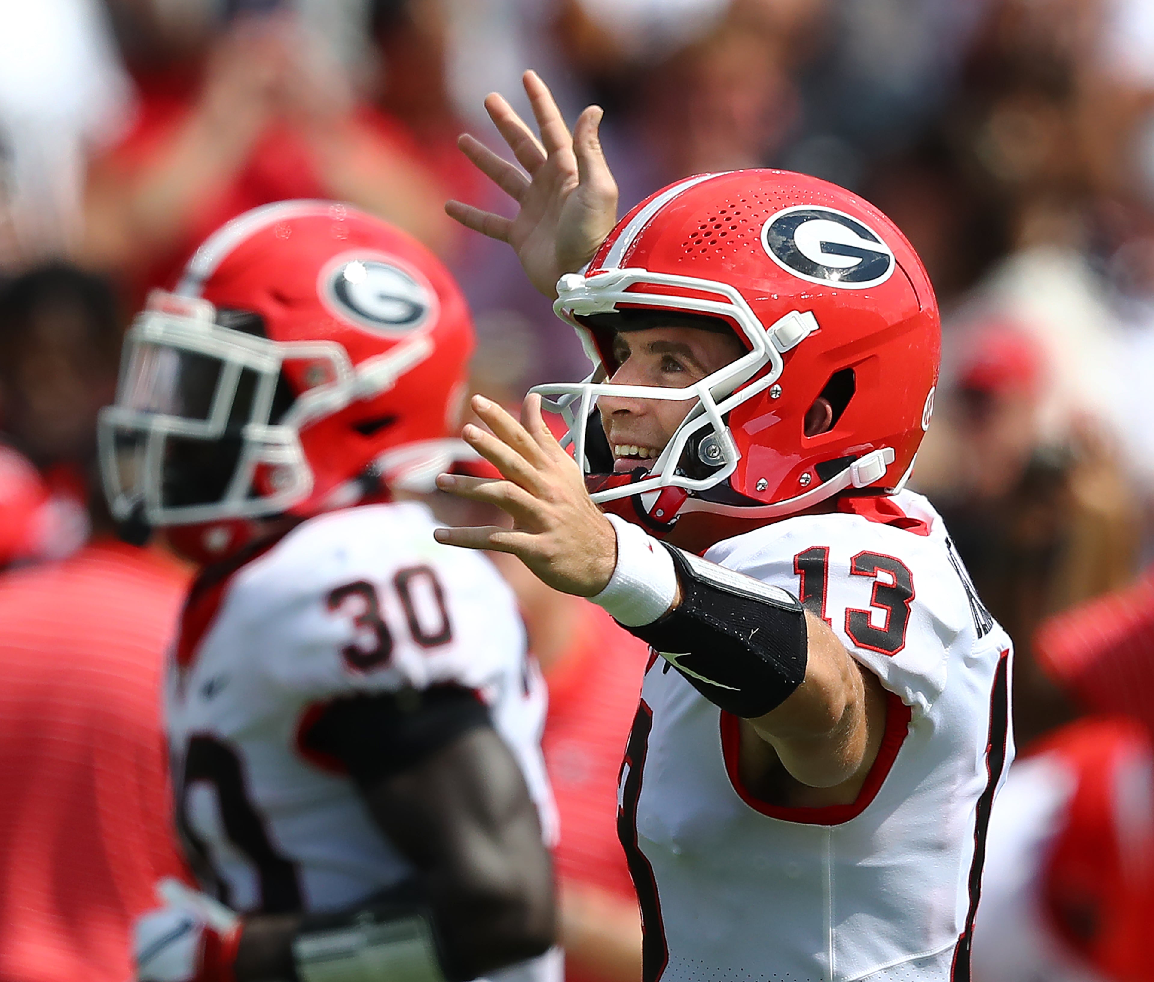 Georgia quarterback Stetson Bennett celebrates his touchdown pass to tight end Brock Bowers that went for a 31-0 lead over South Carolina during the third quarter on the way to a 48-7 victory in a NCAA college football game on Saturday, Sept. 17, 2022, in Columbia. “Curtis Compton / Curtis Compton@ajc.com