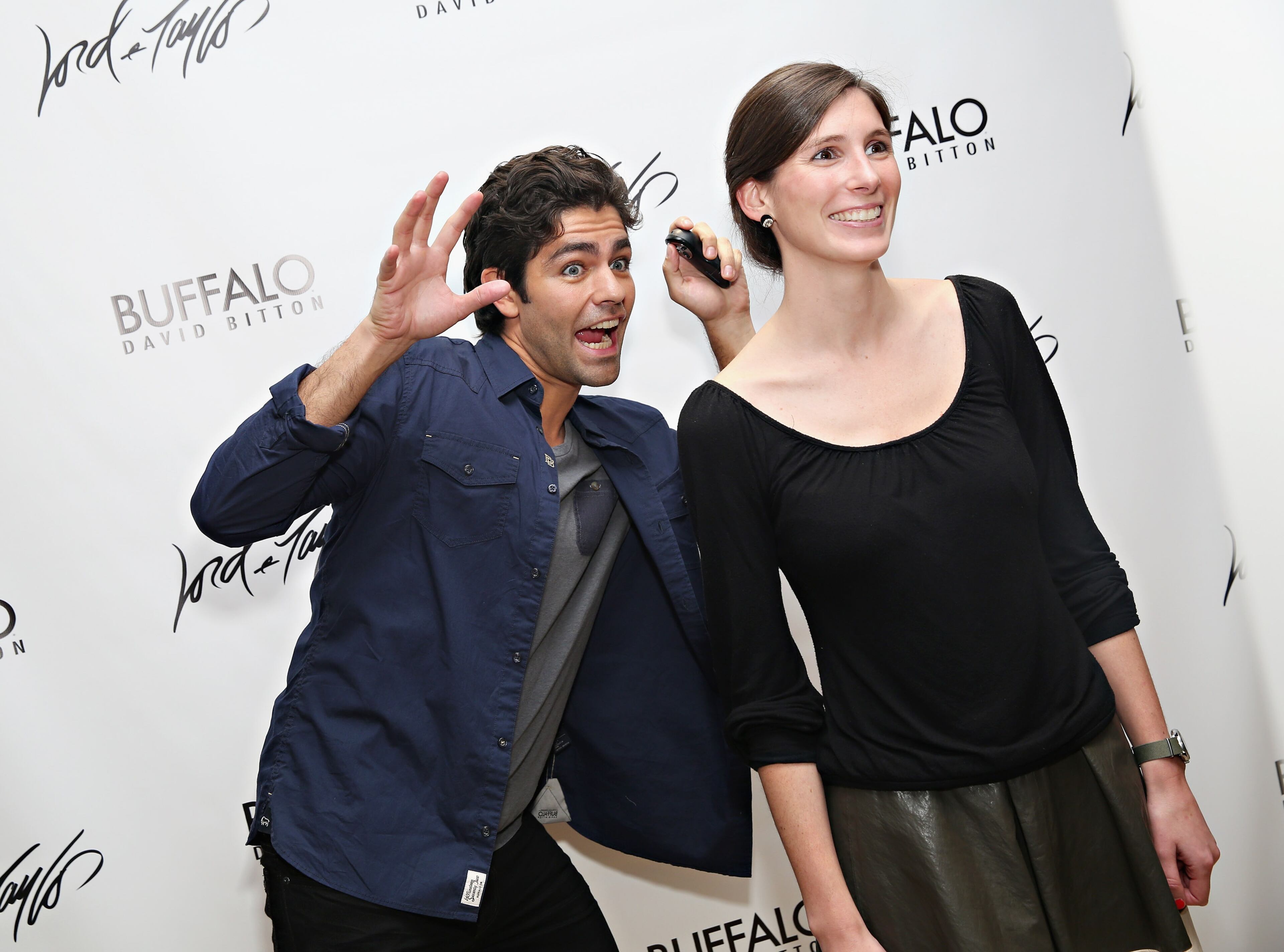 NEW YORK, NY - MAY 11: Adrian Grenier (L) photobombs a guest as Lord & Taylor hosts the actor and Buffalo spokesperson on May 11, 2015 in New York City. (Photo by Cindy Ord/Getty Images for Lord & Taylor)
