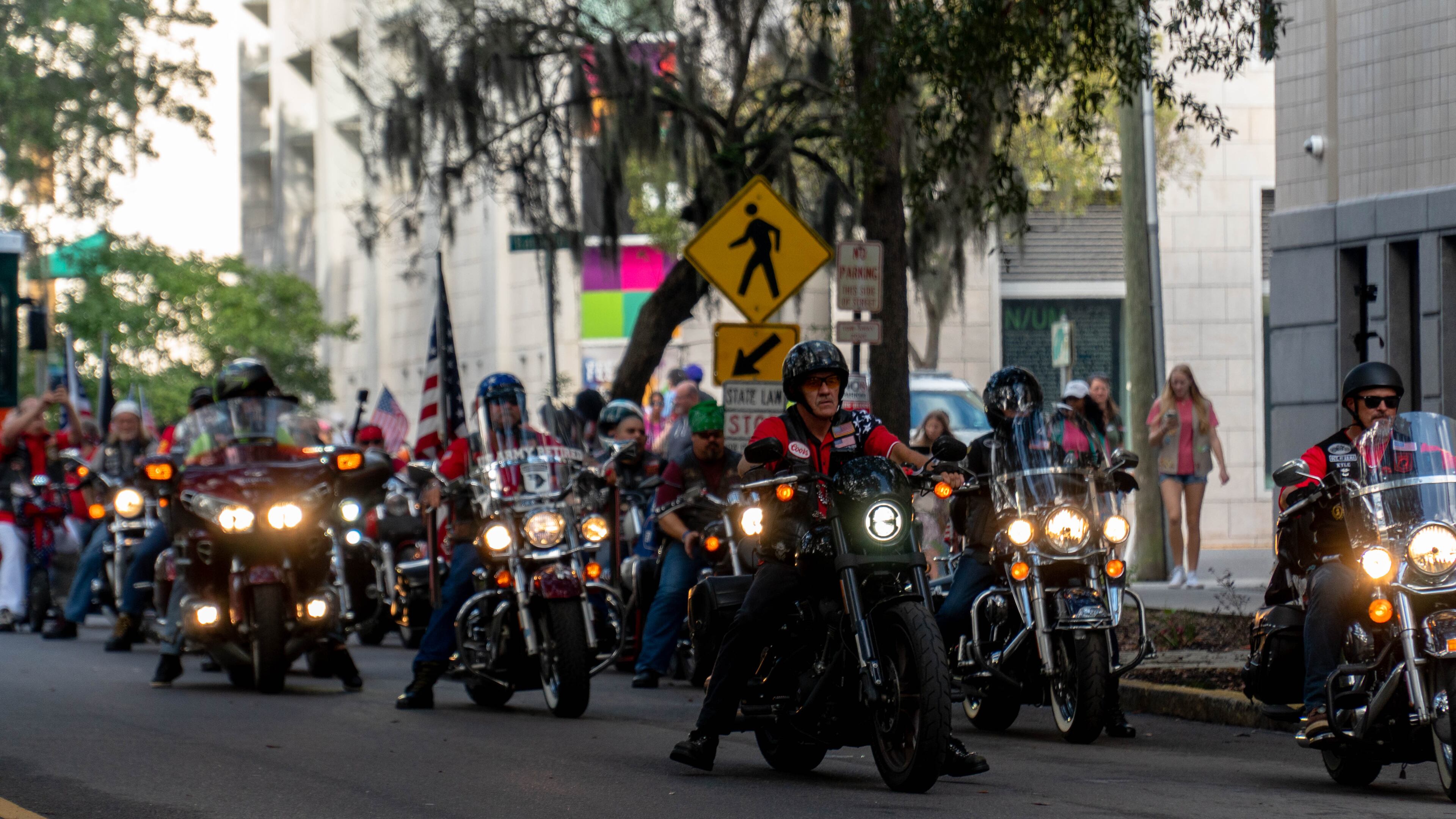 A veteran biker group heads east on Oglethorpe Street towards the parade's end.