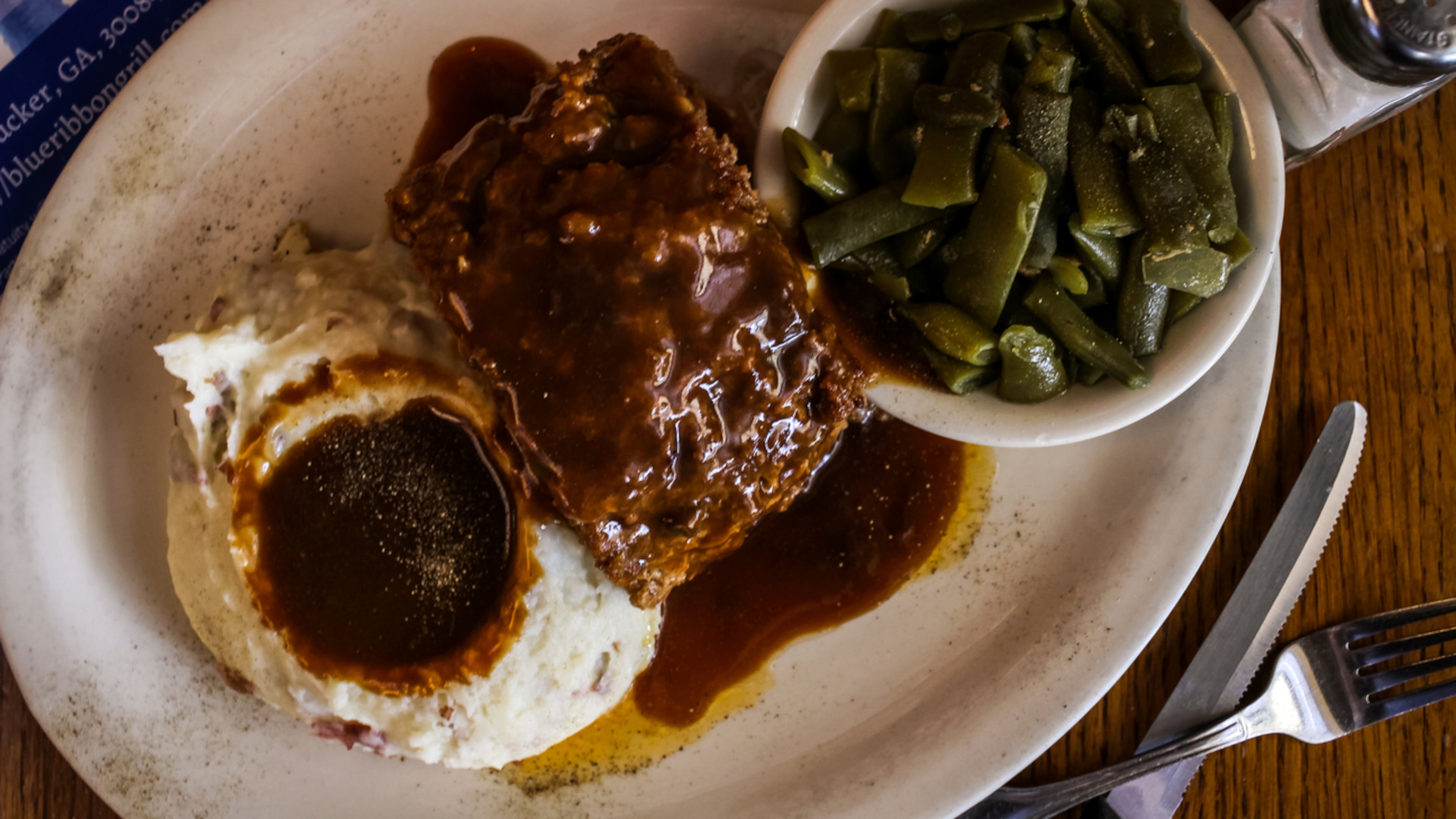 The full meatloaf with mashed potatoes and green beans from Blue Ribbon Grill.