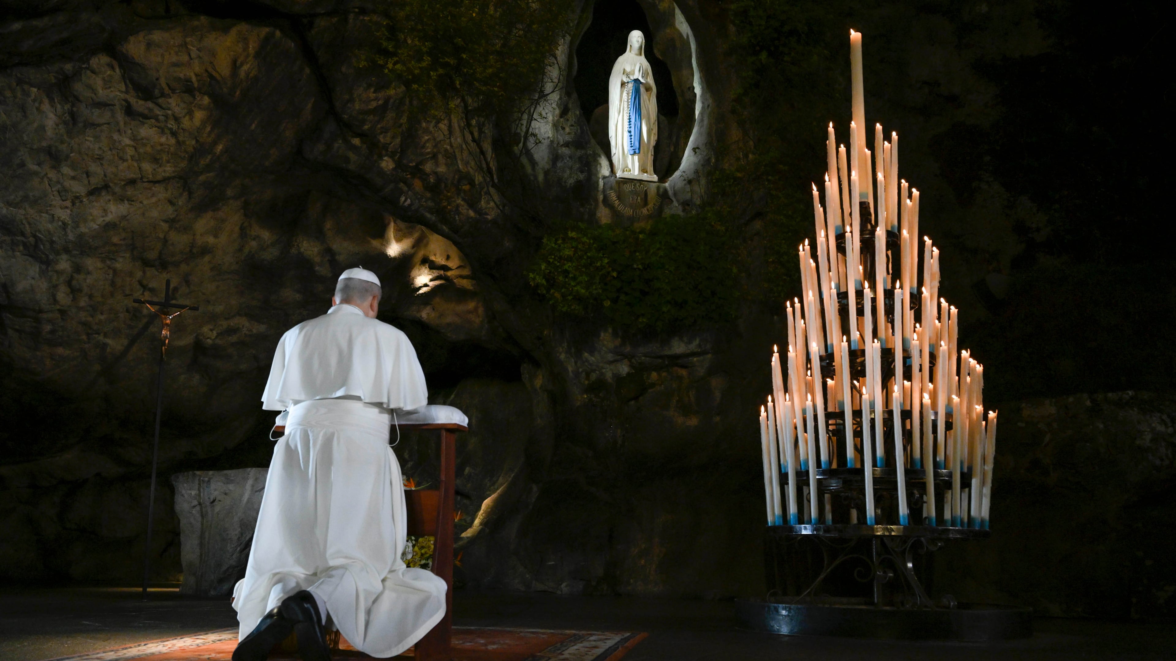 In this handout photo provided by Vatican Media Pope Leo XIV prays at the Grotto of the Apparitions of Massabielle, in Lourdes, France, Saturday, Sept. 26, 2026. (Vatican Media via AP)
