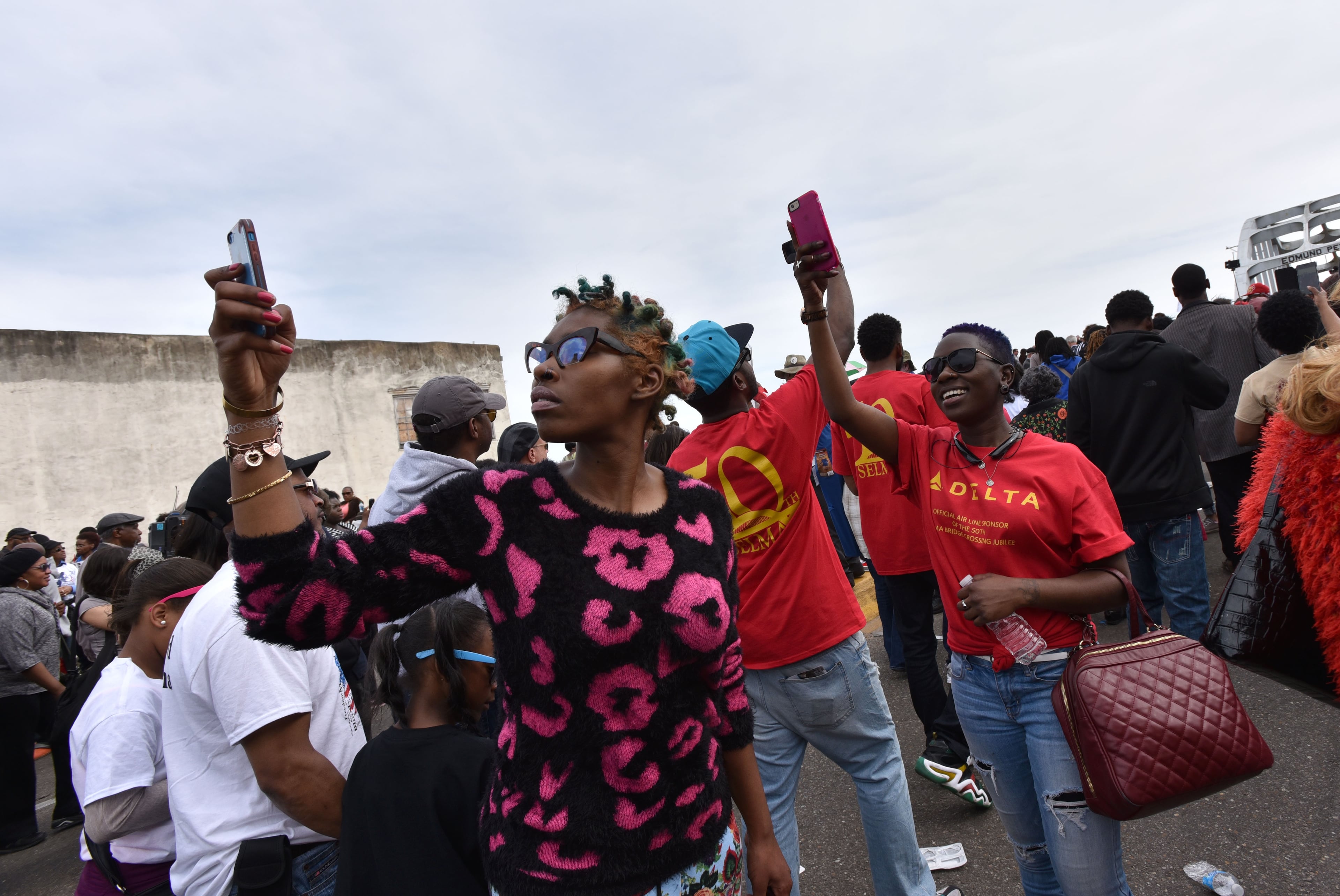 March 8, 2015 Selma, Alabama - Participants take pictures as crowds of people take a symbolic walk across the Edmund Pettus Bridge in Selma on Sunday, March 8, 2015. Thousands of people took part in a bridge crossing reenactment in Selma on Sunday to commemorate the 50th anniversary of Bloody Sunday. HYOSUB SHIN / HSHIN@AJC.COM
