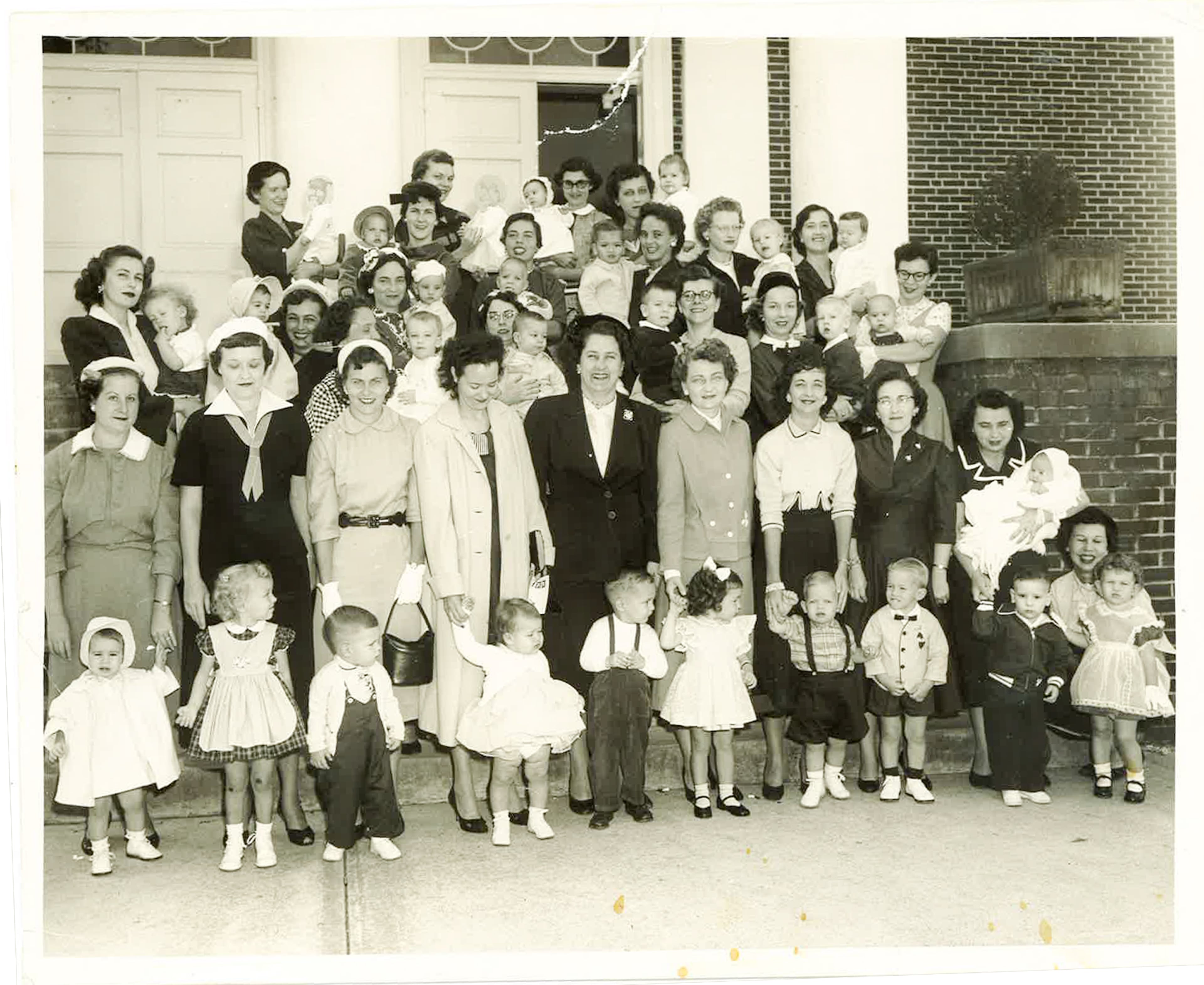 Thompson is the self-described "fuzzy headed kid" shown here in the arms of her mother, Ruth, at East Point Christian Church in 1957.