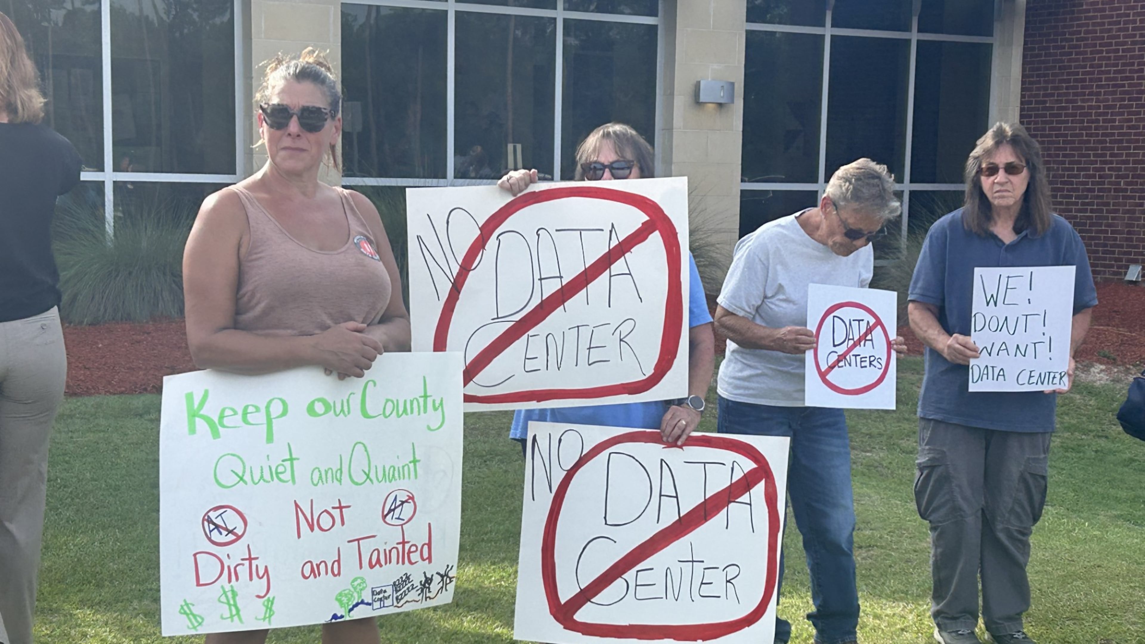 Protesters gathered outside an OpenAI data center open house in Effingham County in July. (Adam Van Brimmer/AJC)