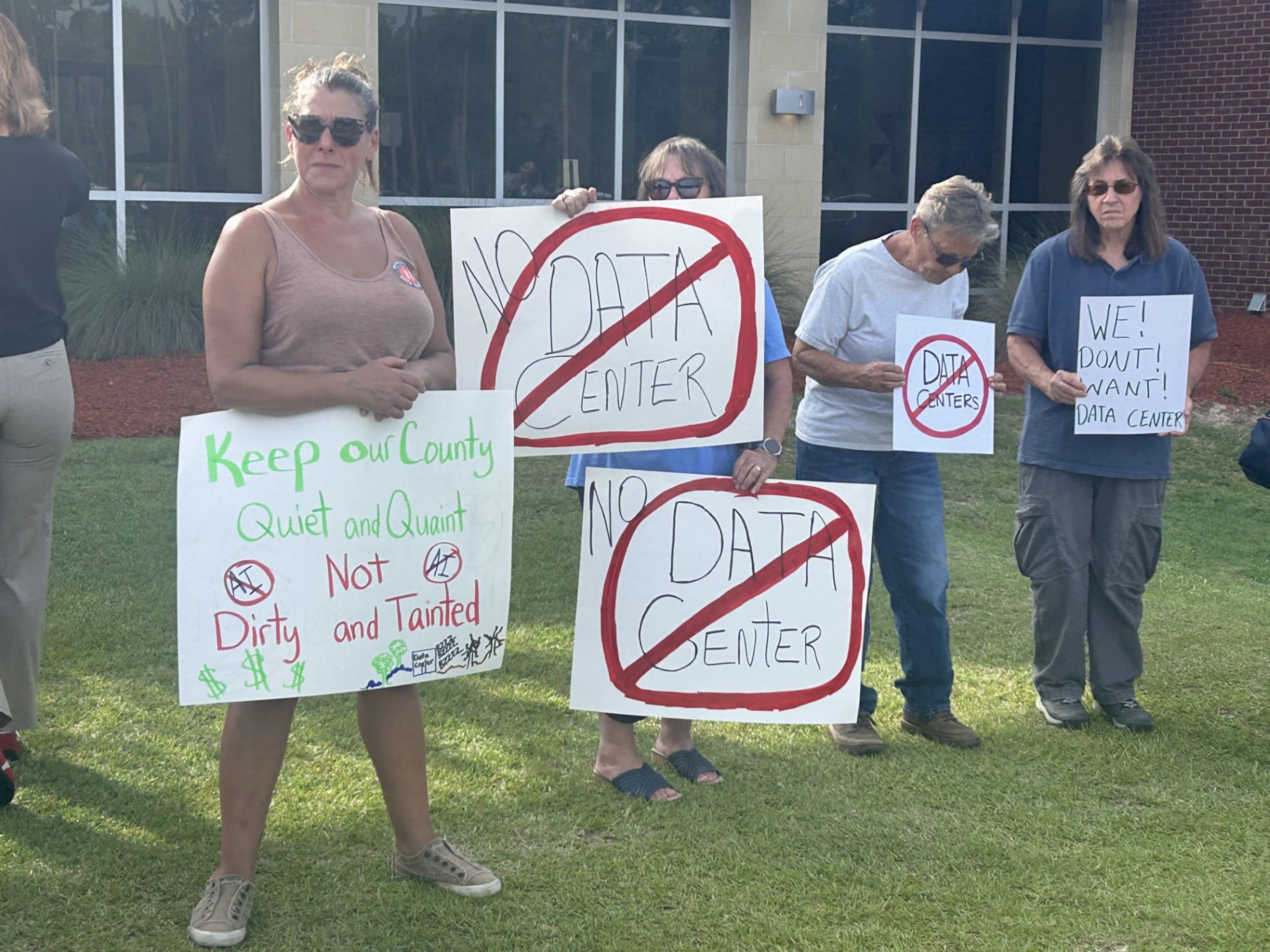 Protesters gather outside the OpenAI data center open house on Thursday, July 23, 2026. More than 100 Savannah-area residents demonstrated against the project. (Adam Van Brimmer/AJC)