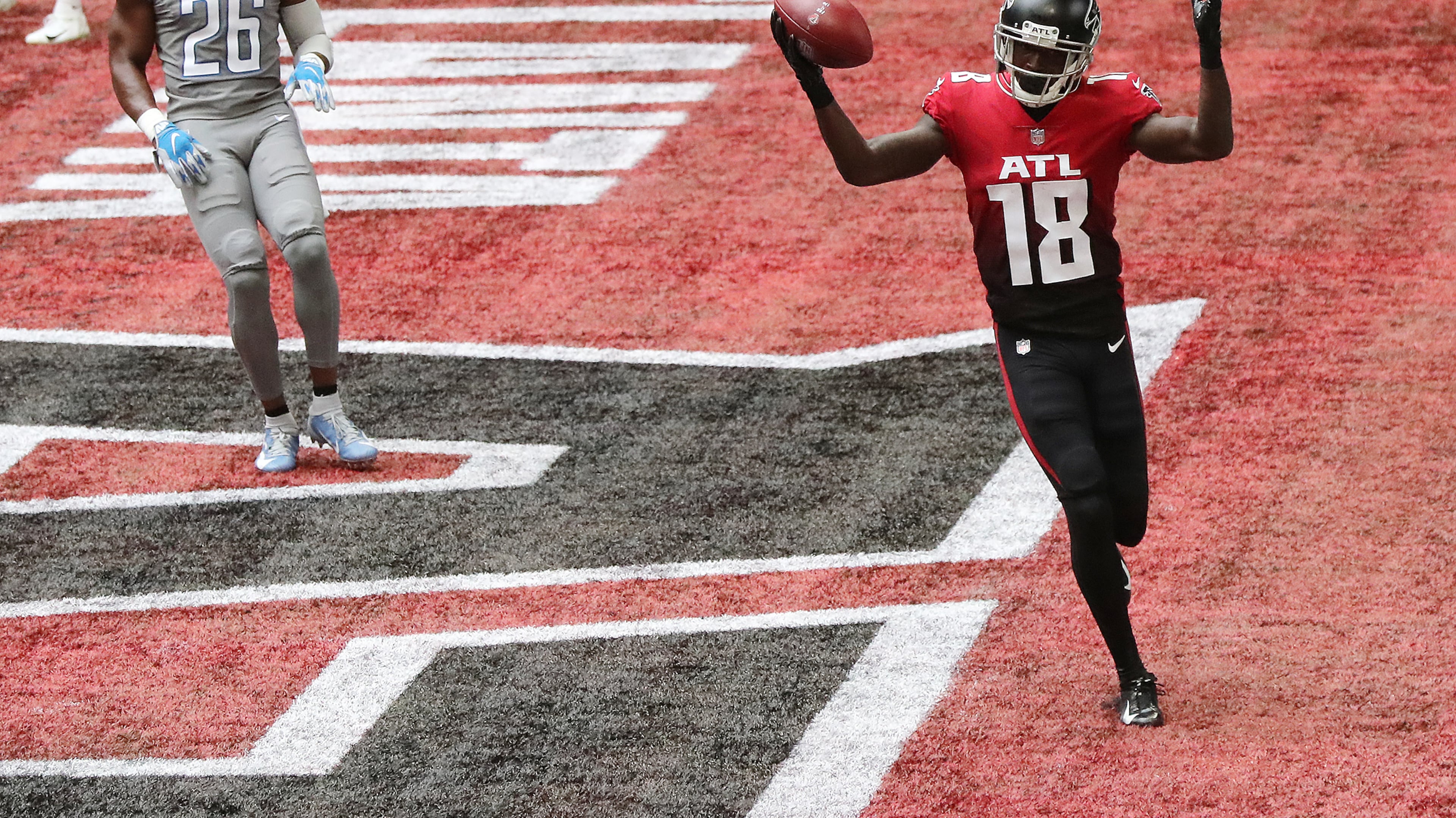 Falcons wide receiver Calvin Ridley celebrates a touchdown catch over Detroit Lions safety Duron Harmon on Oct. 25, 2020. (Curtis Compton / Curtis.Compton@ajc.com)