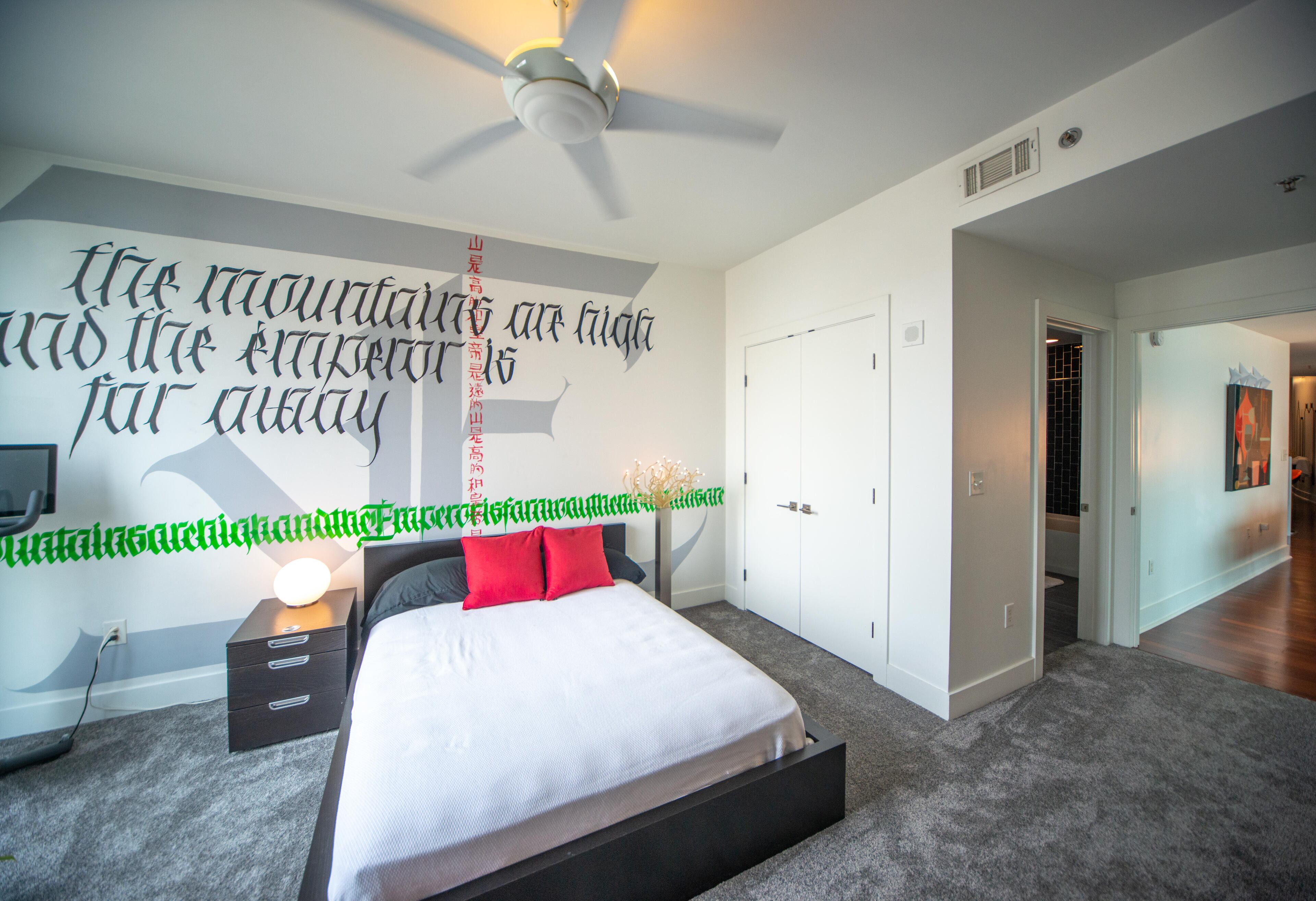 One of two extra bedrooms that face east and has knockout shade and beautiful wall mural. Text by Eric Salsbery