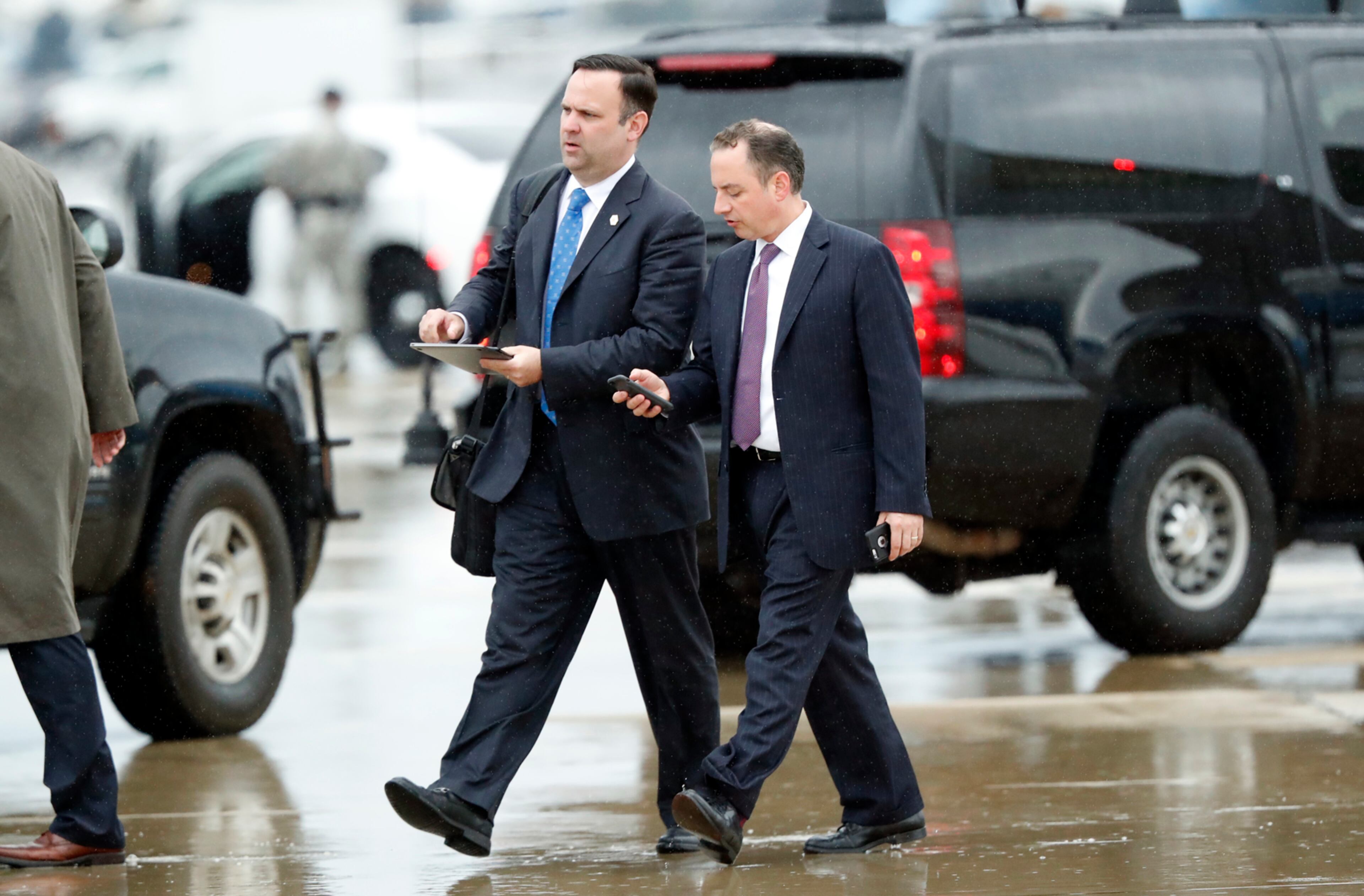 White House Director of Social Media Dan Scavino, left, walks to a vehicle with former White House Chief of Staff Reince Priebus as they arrive Friday, July 28, 2017, at Andrews Air Force Base, Md. Trump says Homeland Secretary Secretary John Kelly is his new White House chief of staff. (AP Photo/Alex Brandon)