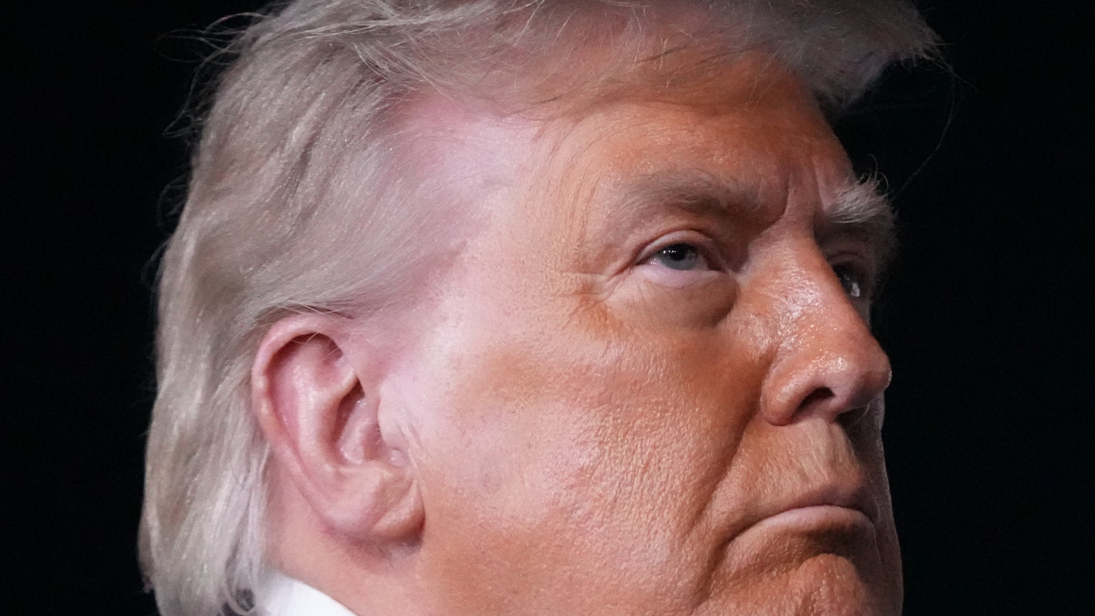 Some in the Wheeler High community are upset by President Donald Trump's visit to the school on Wednesday to promote his new savings plans. One alumna said it's a "slap in the face" to the school's diverse student body. (Mark Schiefelbein/AP)