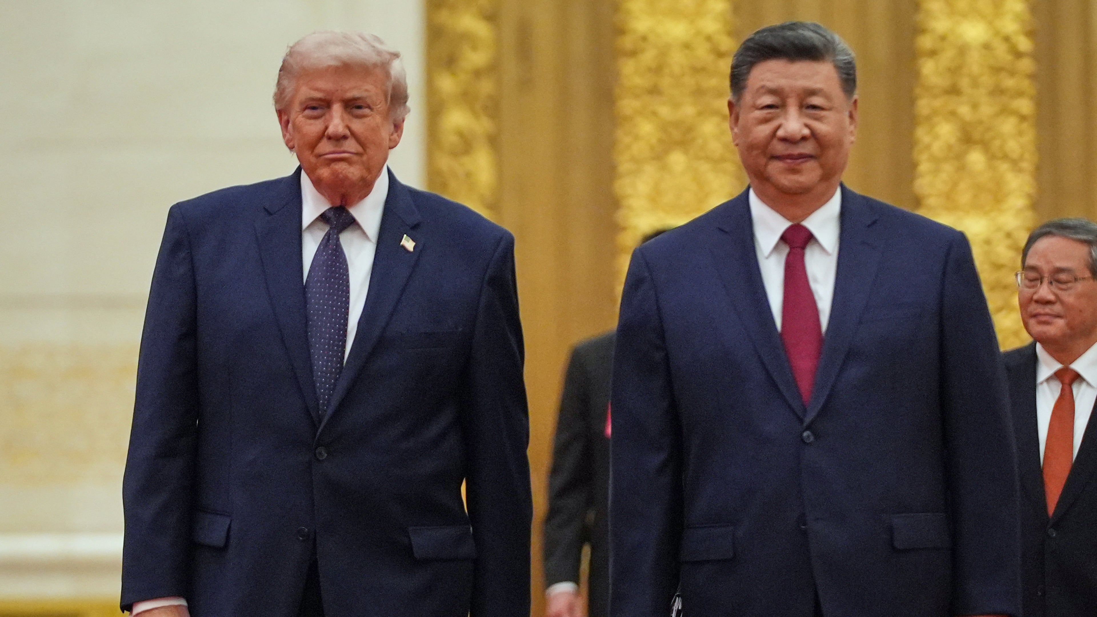FILE - President Donald Trump, left, and Chinese President Xi Jinping arrive a state dinner at the Great Hall of the People May 14, 2026, in Beijing. (AP Photo/Mark Schiefelbein)