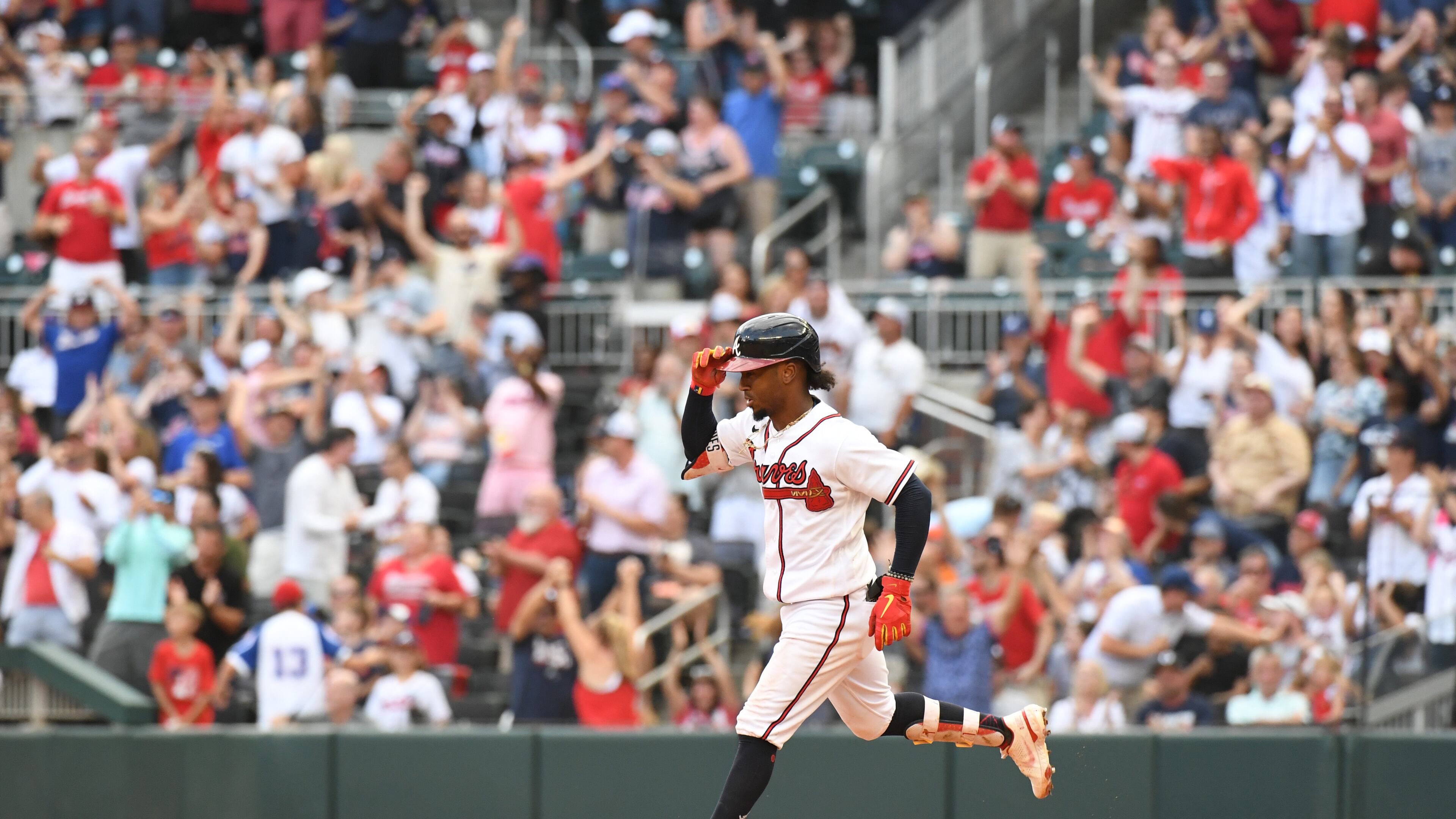 Braves' Ozzie Albies circles the bases after hitting a home run at Truist Park on Saturday, June 11, 2022. (Hyosub Shin / Hyosub.Shin@ajc.com)