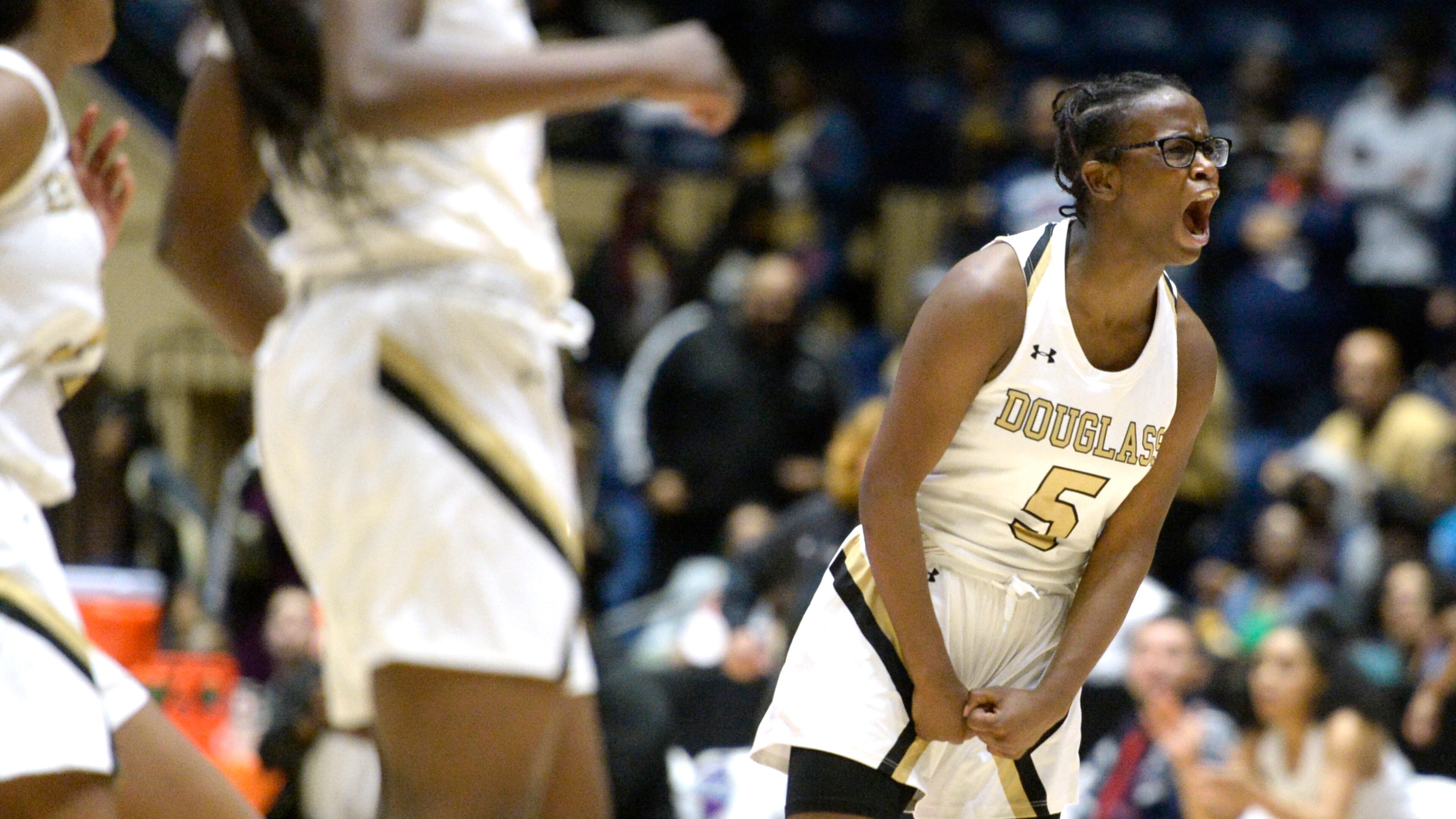 Douglass guard Kayla Sesberry (5) belts out a scream after an Astros basket to go up 37-26 during their GHSA AA state championship game against Southwest Macon Thursday. Douglass won 56-46. JASON VORHEES / THE MACON TELEGRAPH