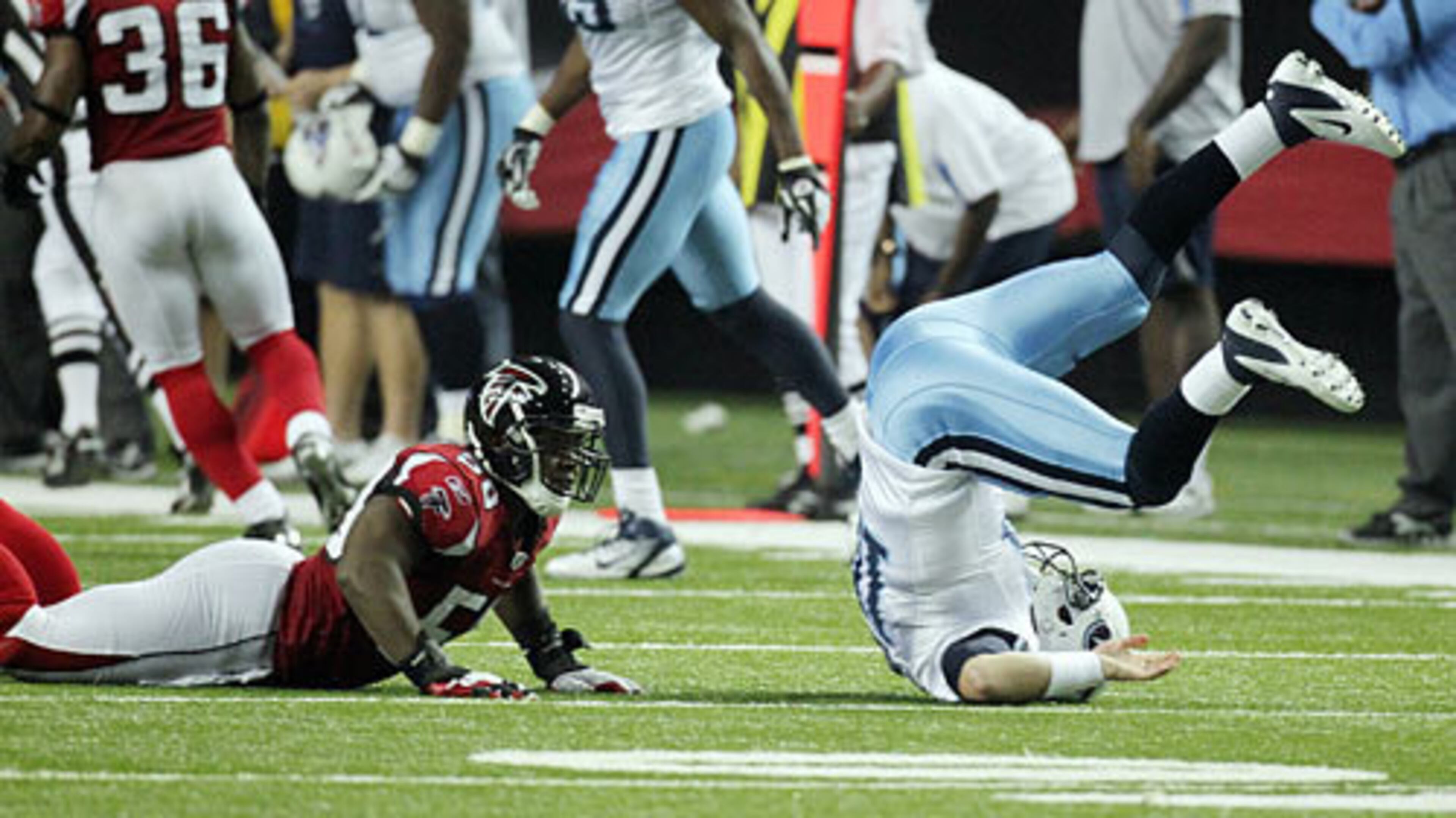 Falcons linebacker Curtis Lofton makes Titans quarterback Jake Locker pay the price leveling him with a hit during 2nd half action, but Locker got off the pass to Nate Washington that went for a touchdown.