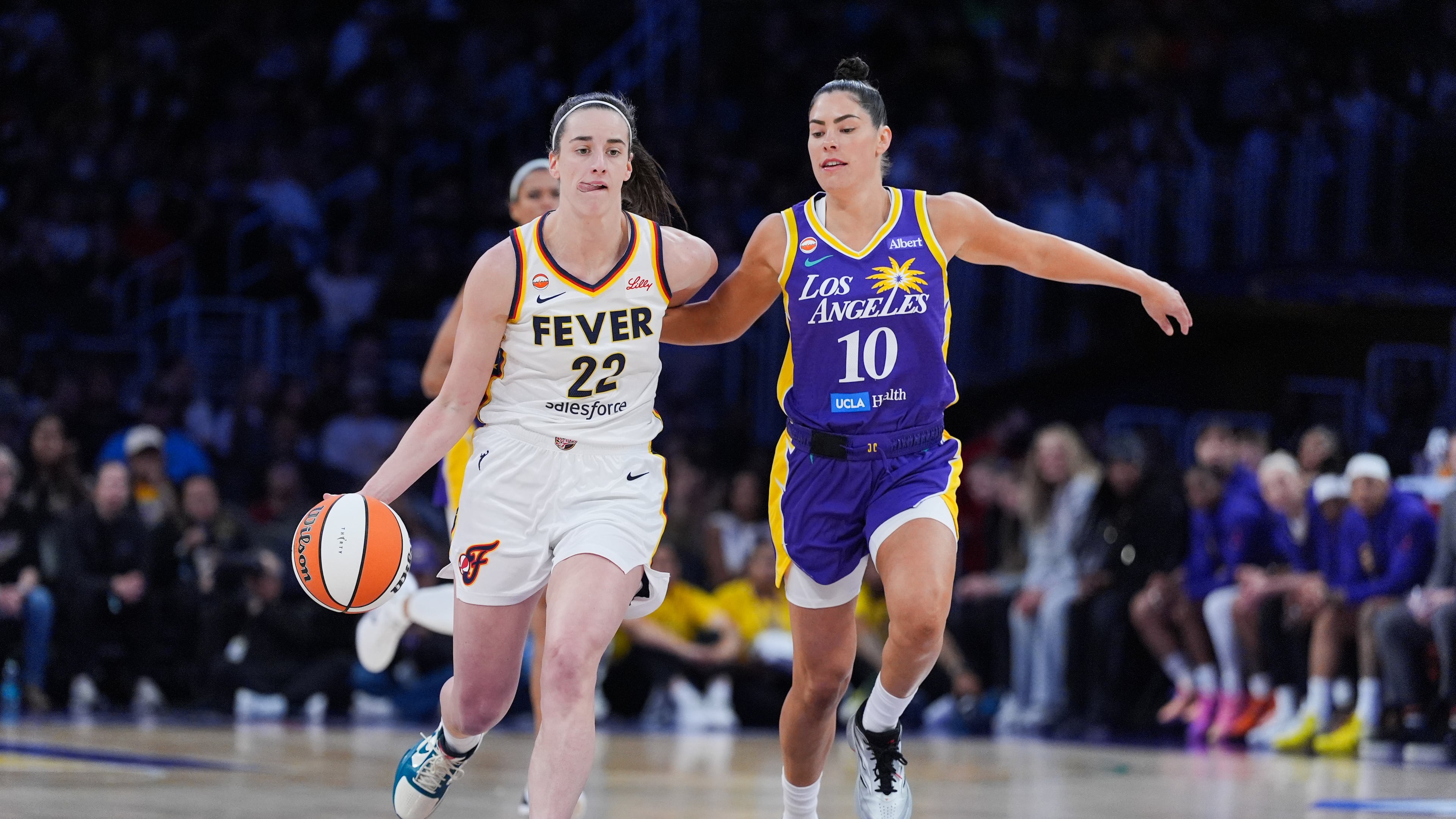 Los Angeles Sparks guard Kelsey Plum (10) pressures Indiana Fever guard Caitlin Clark (22) during the first half of a WNBA basketball game Wednesday, May 13, 2026, in Los Angeles. (AP Photo/Jae C. Hong)