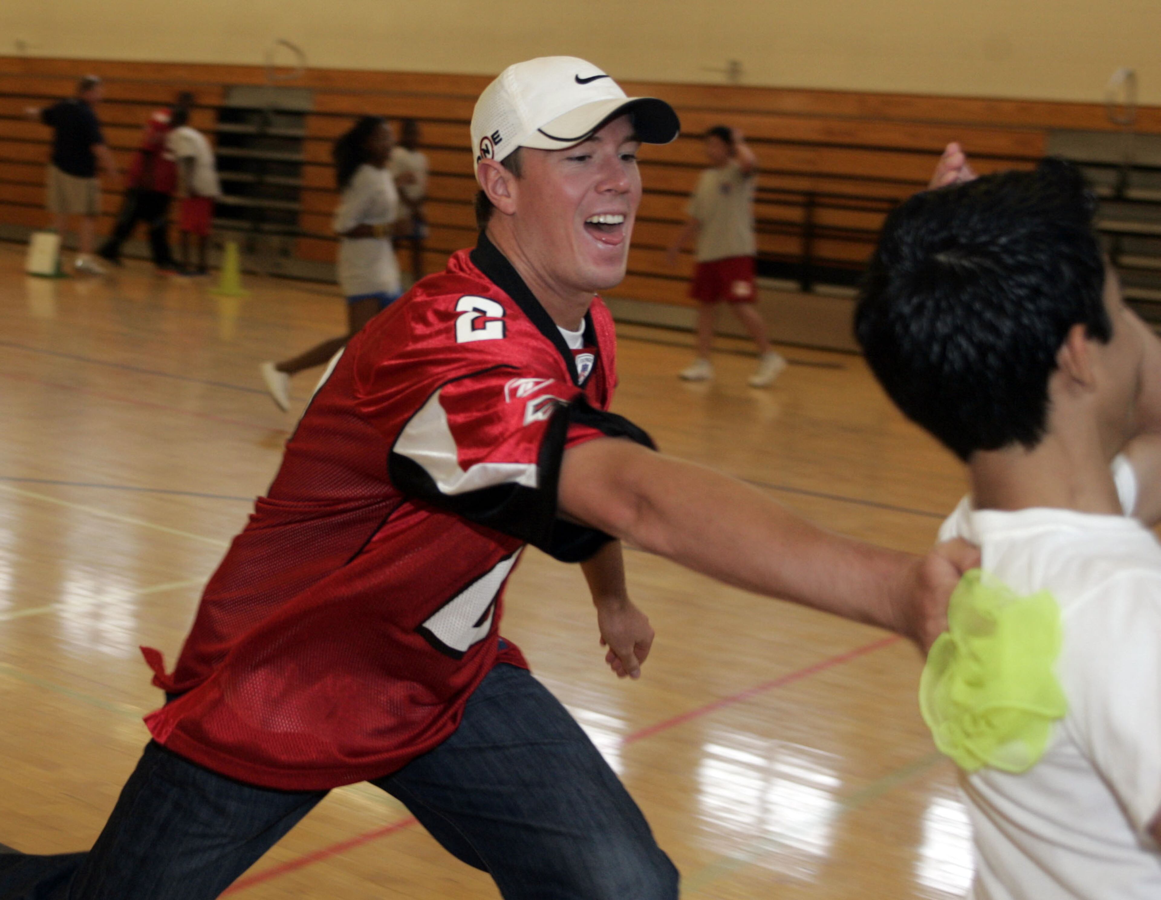 Falcon quarterback Matt Ryan (left) tags Jhonatan Sorto as players visited Sandy Springs Middle School on Tuesday during a League-wide day off service for the NFL-United Way Hometown Huddle, a series of volunteer projects implemented on the same day nationwide. helping kids stay active for 60 minutes a day as part of "NFL PLAY 60", the League's youth health and fitness campaign. Now in its 36th year, the United Way/NFL partnership connects "NFL PLAY 60" with United Way's goal of 1.9 million more healthy young people by 2018. Designed to tackle childhood obesity, "NFL PLAY 60" brings together the NFL's long-standing commitment to health and fitness with partner organizations like United Way. PHIL SKINNER, pskinner@ajc.com editor's note: CQ