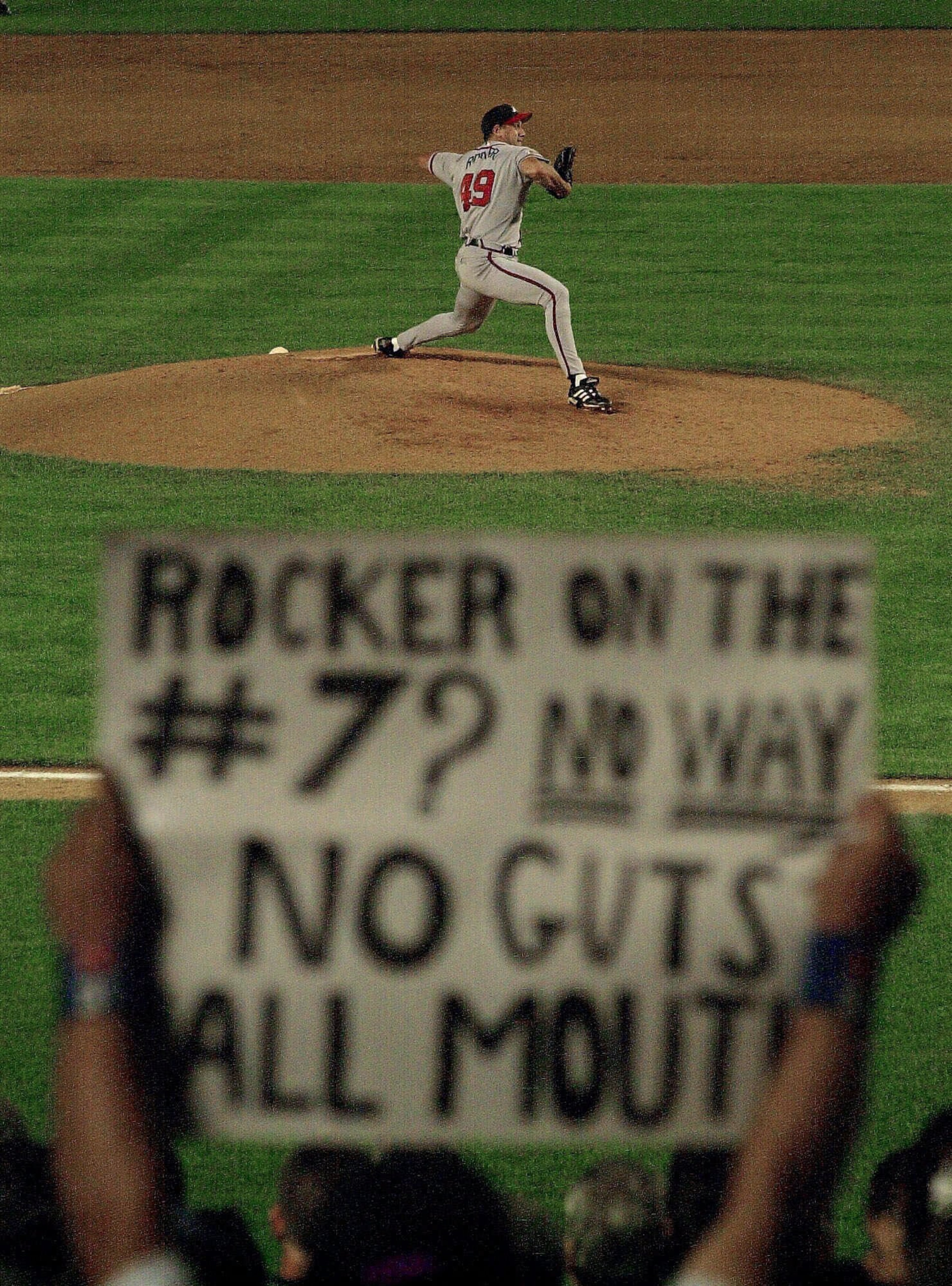 Rocker throws a pitch in the bottom of the eighth at Shea Stadium in New York. (AP Photo/Ron Frehm)