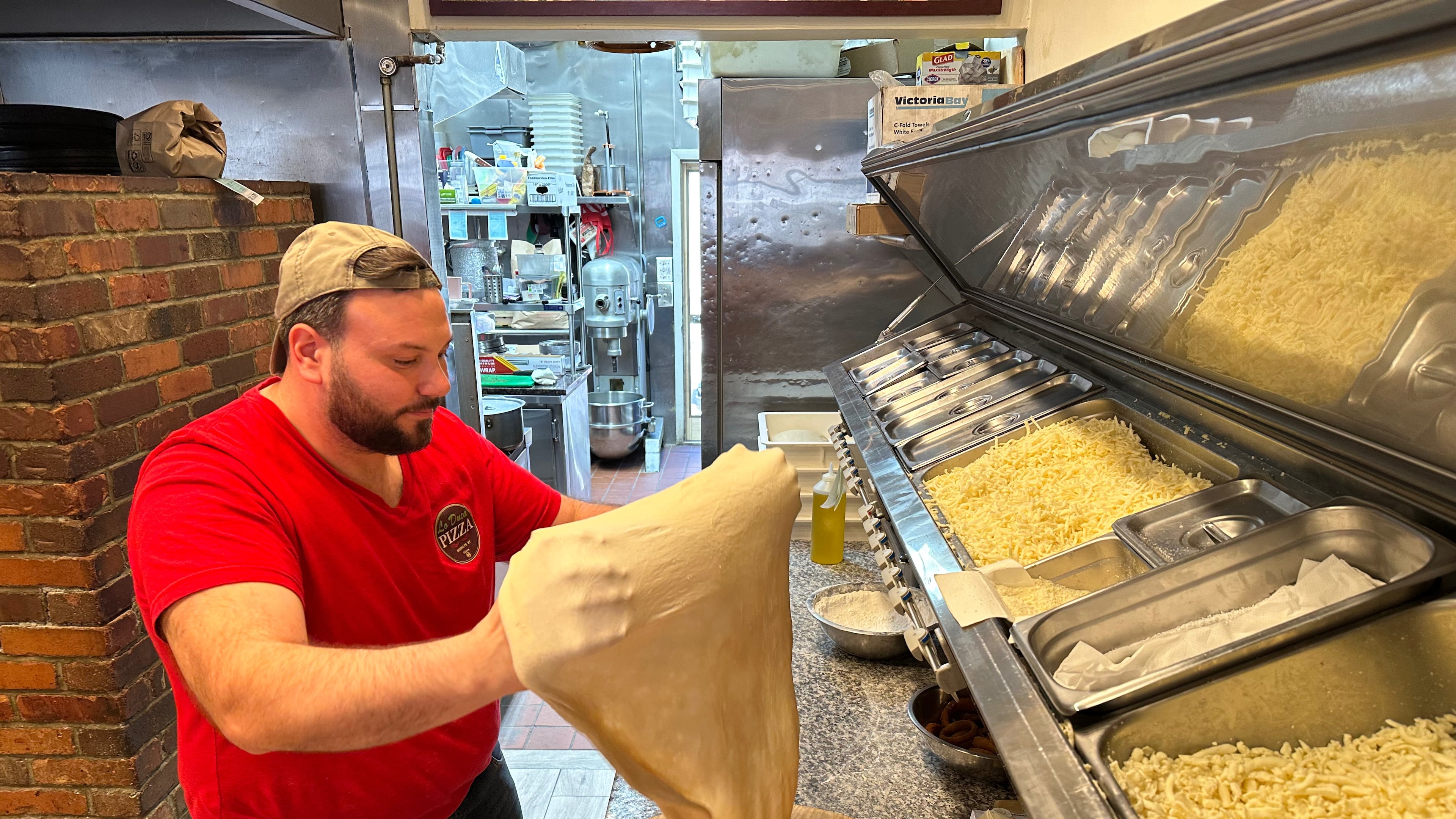 Salvatore Lo Duca makes pizza at Lo Duca Pizza Tuesday, May 12, 2026, in the Brooklyn borough of New York. (AP Photo/David R. Martin)