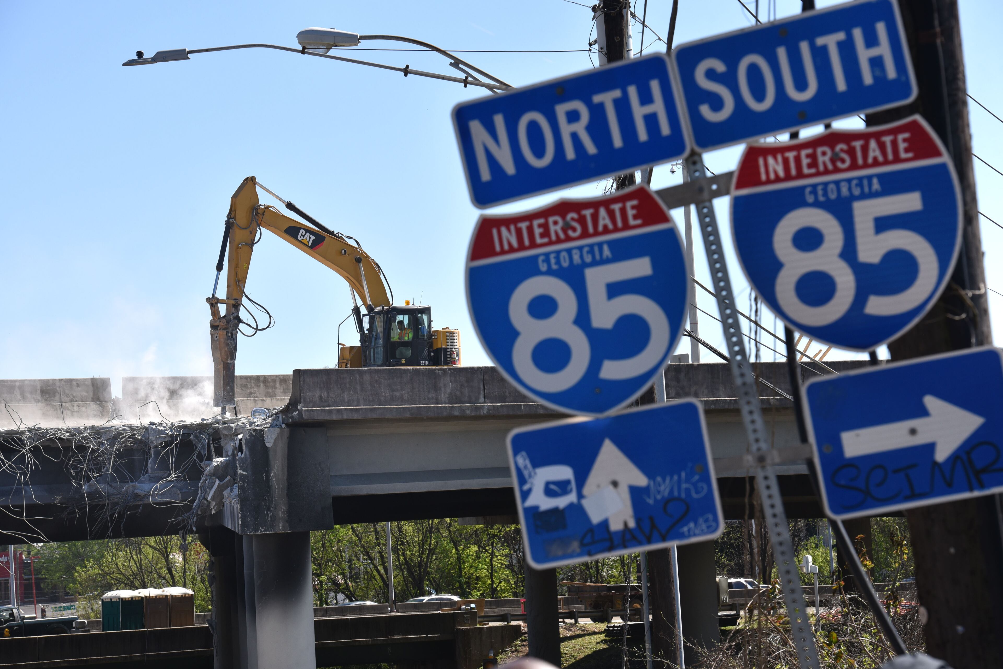 Crews demolish damaged sections of I-85 bridge structures on Saturday, April 1, 2017. With I-85 closed for an indefinite amount of time, Atlanta is headed for a transportation nightmare. HYOSUB SHIN / HSHIN@AJC.COM