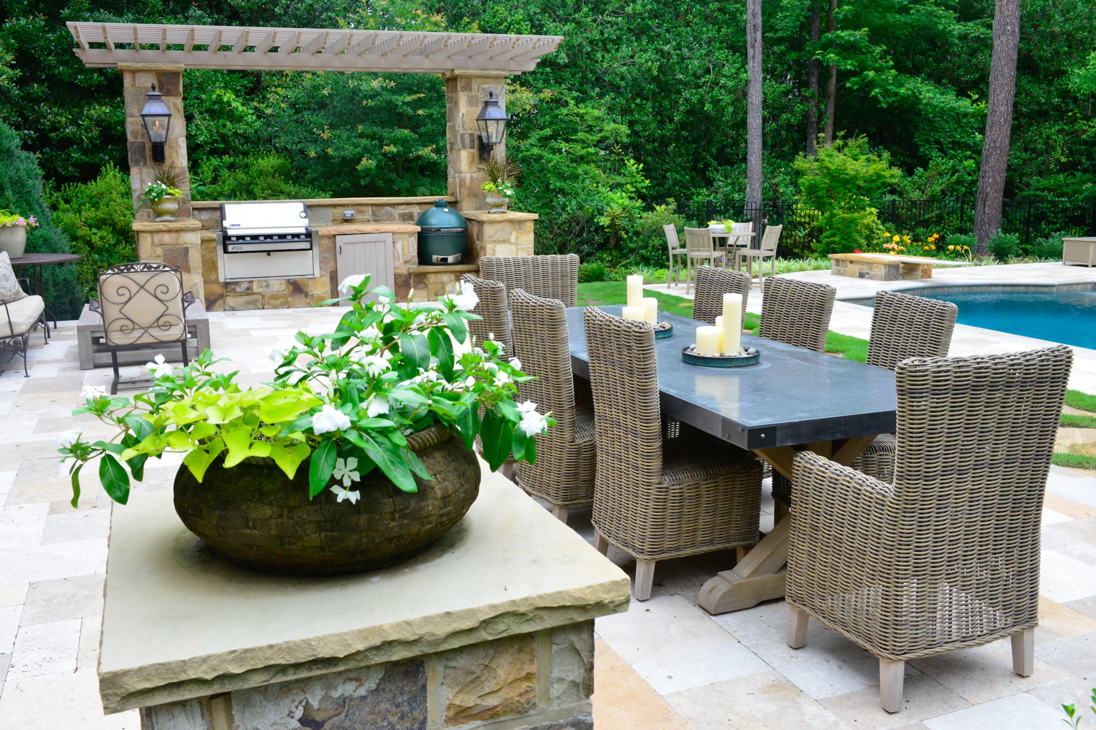 The long outdoor table and chairs, which overlook the pool, were purchased from Restoration Hardware. -- Text by Lori Johnston