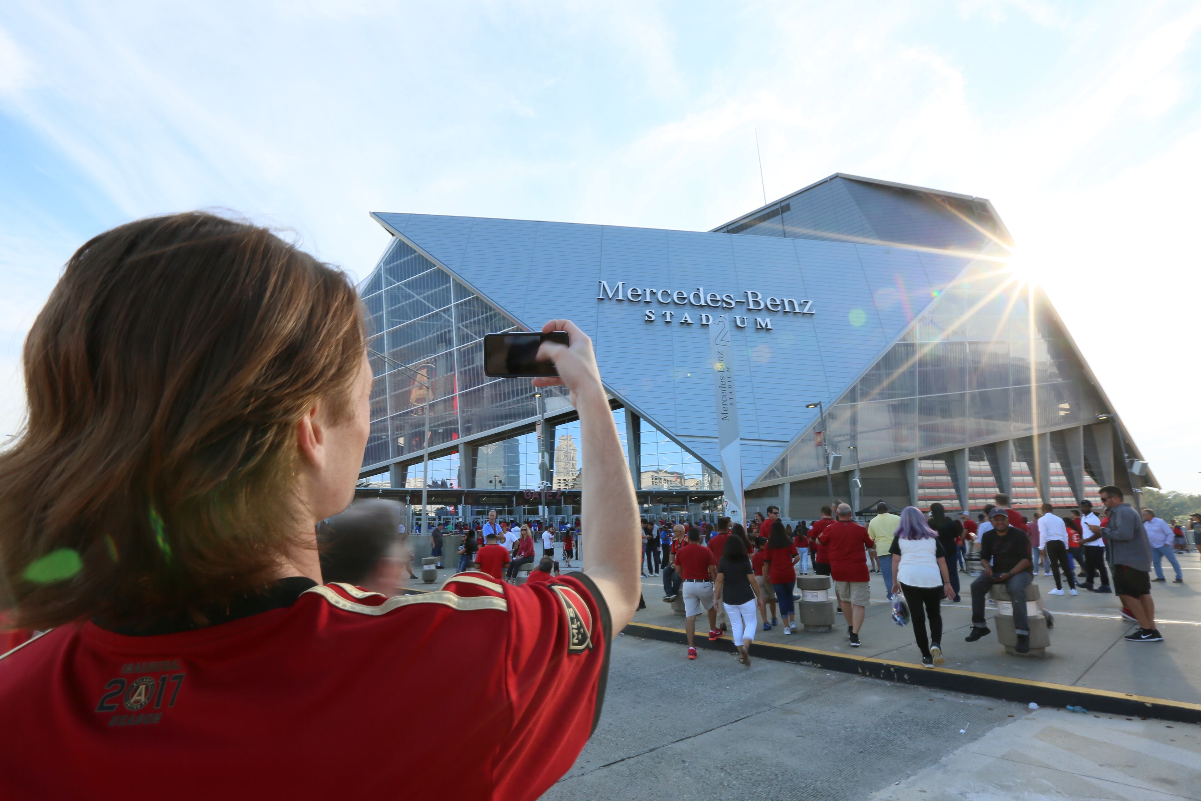 Alex Jones of Chattanooga takes a photo of Mercedes-Benz Stadium.