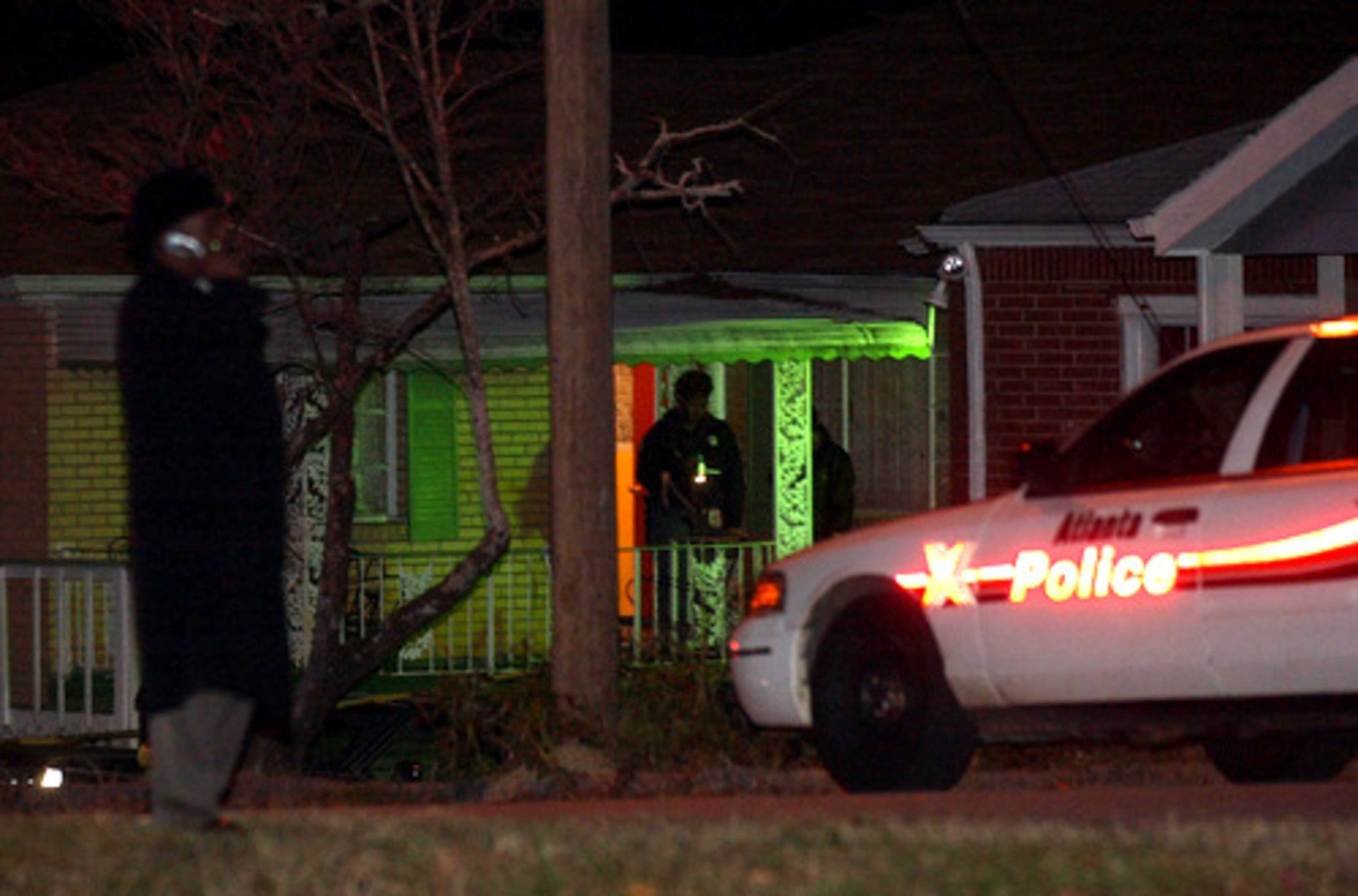Police are on the scene the night of the shooting at Johnston's house on Neal Street.