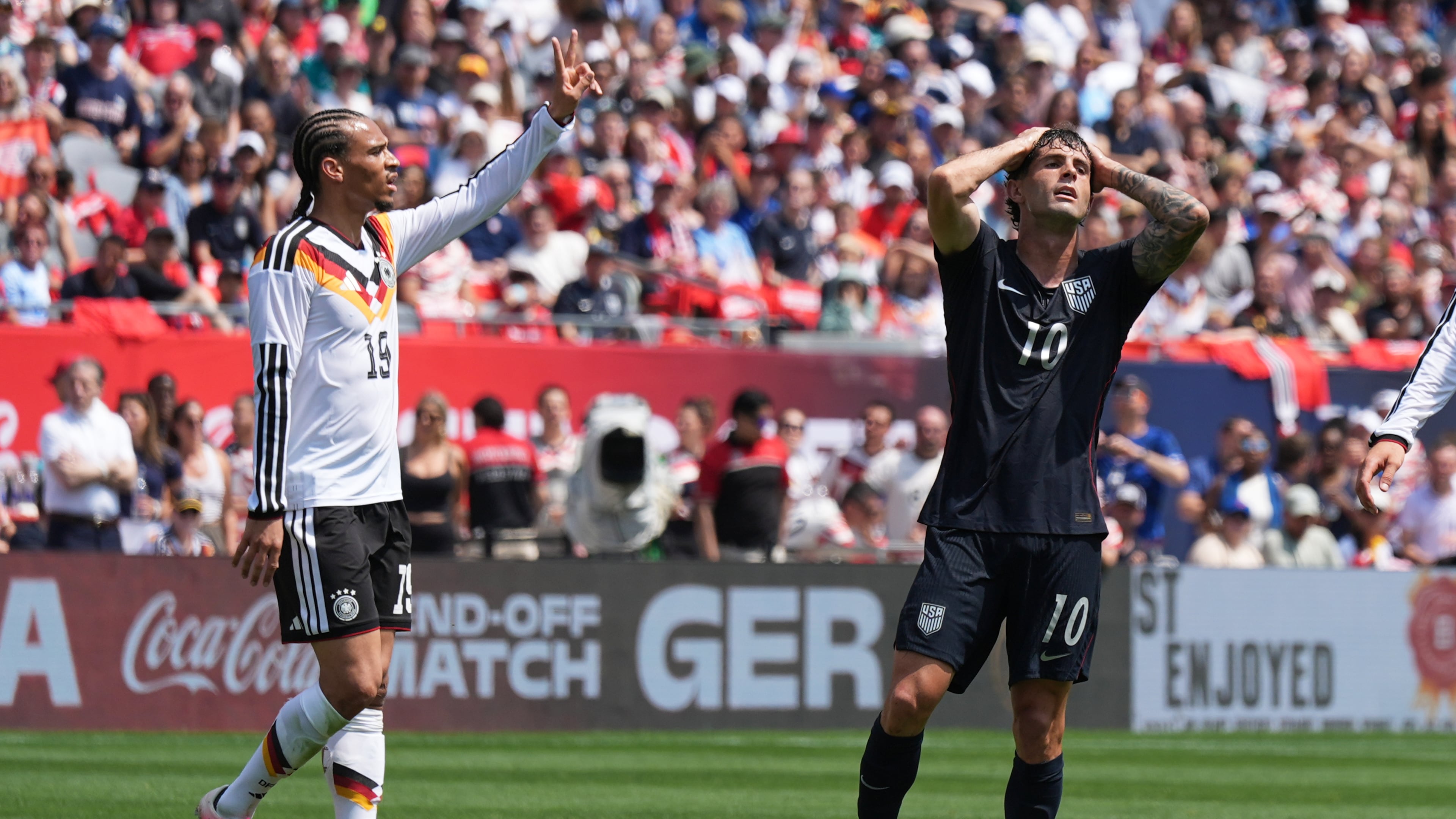 United States forward Christian Pulisic, right, reacts after a missed a shot as Germany forward Leroy Sané celebrates during the first half of an international friendly soccer match in Chicago, Saturday, June 6, 2026. (AP Photo/Nam Y. Huh)