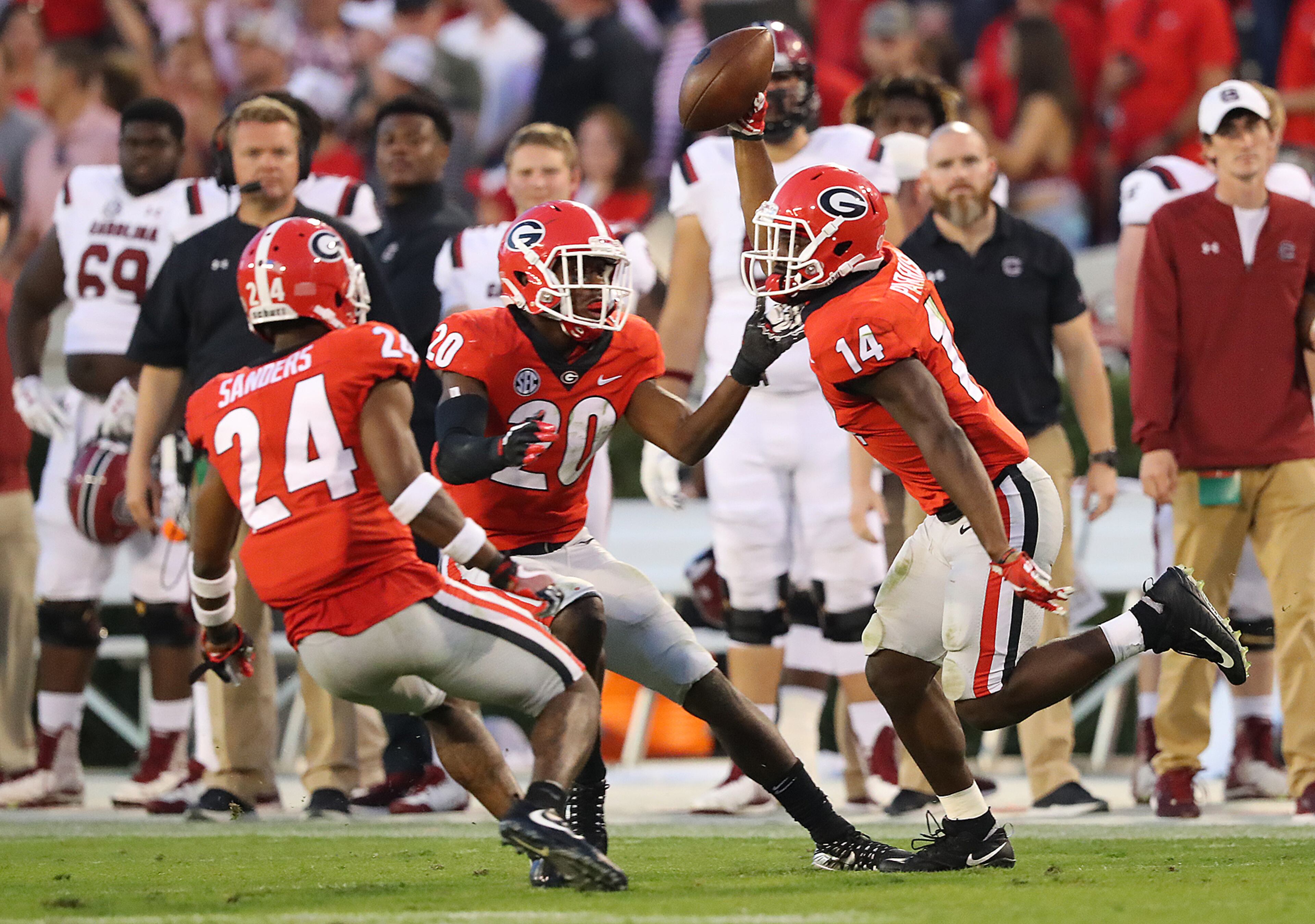 November 4, 2017 Athens: Malkom Parrish celebrates intercepting South Carolina quarterback Jake Bentley in the final minutes with J.R. Reed and Dominick Sanders for a 24-10 victory and a 9-0 record in a NCAA college football game on Saturday, November 4, 2017, in Athens. Curtis Compton/ccompton@ajc.com
