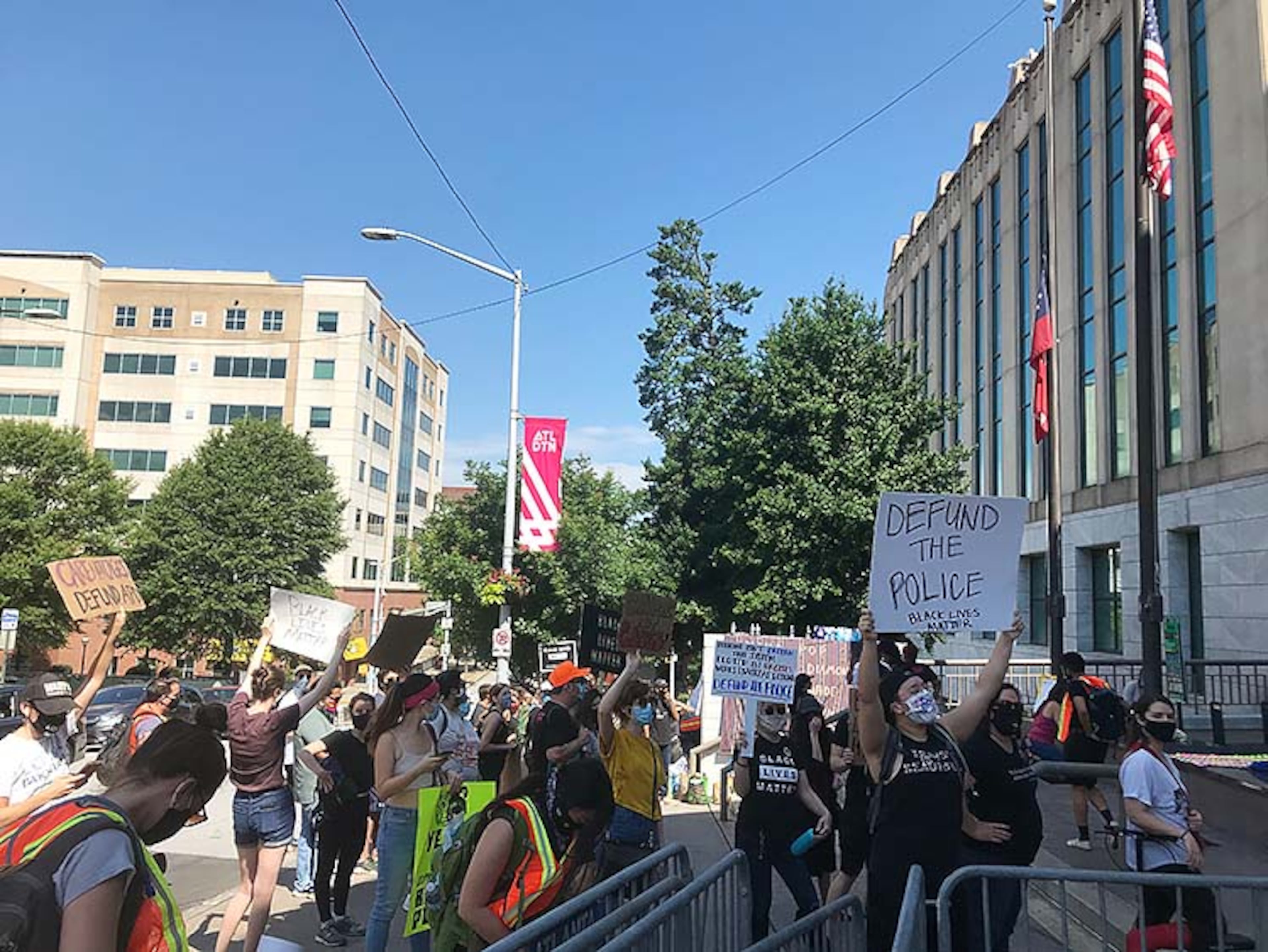 Outside Atlanta City Hall, a group of more than 50 protesters chanted “care not cages” and “Black lives matter.” Protesters held signs that read “defund APD.” Protest doesn’t appear to have a specific focus on Juneteenth.