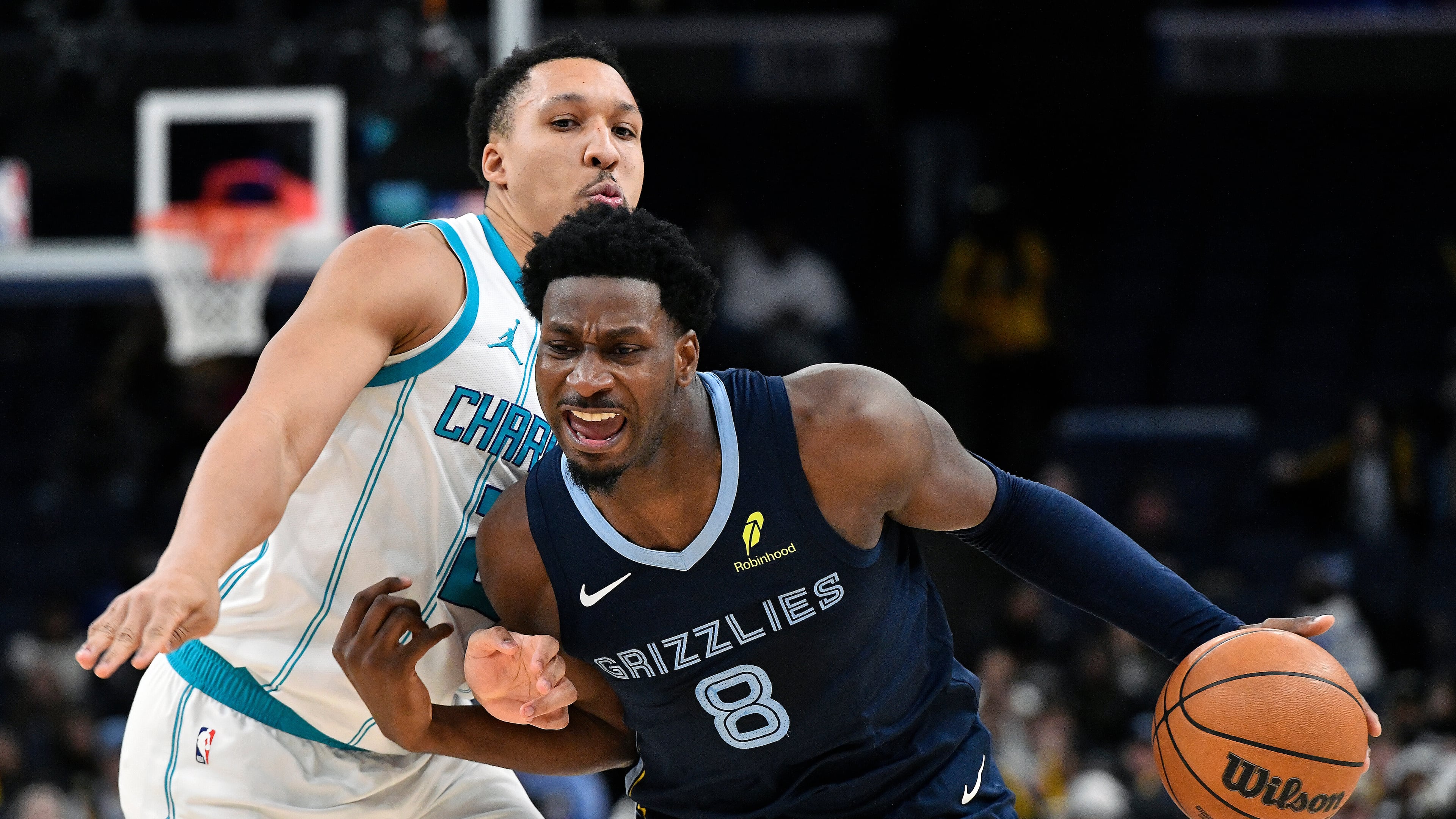 Memphis Grizzlies forward Jaren Jackson Jr. (8) handles the ball against Charlotte Hornets forward Grant Williams (2) in the second half of an NBA basketball game Wednesday, Jan. 28, 2026, in Memphis, Tenn. (AP Photo/Brandon Dill)