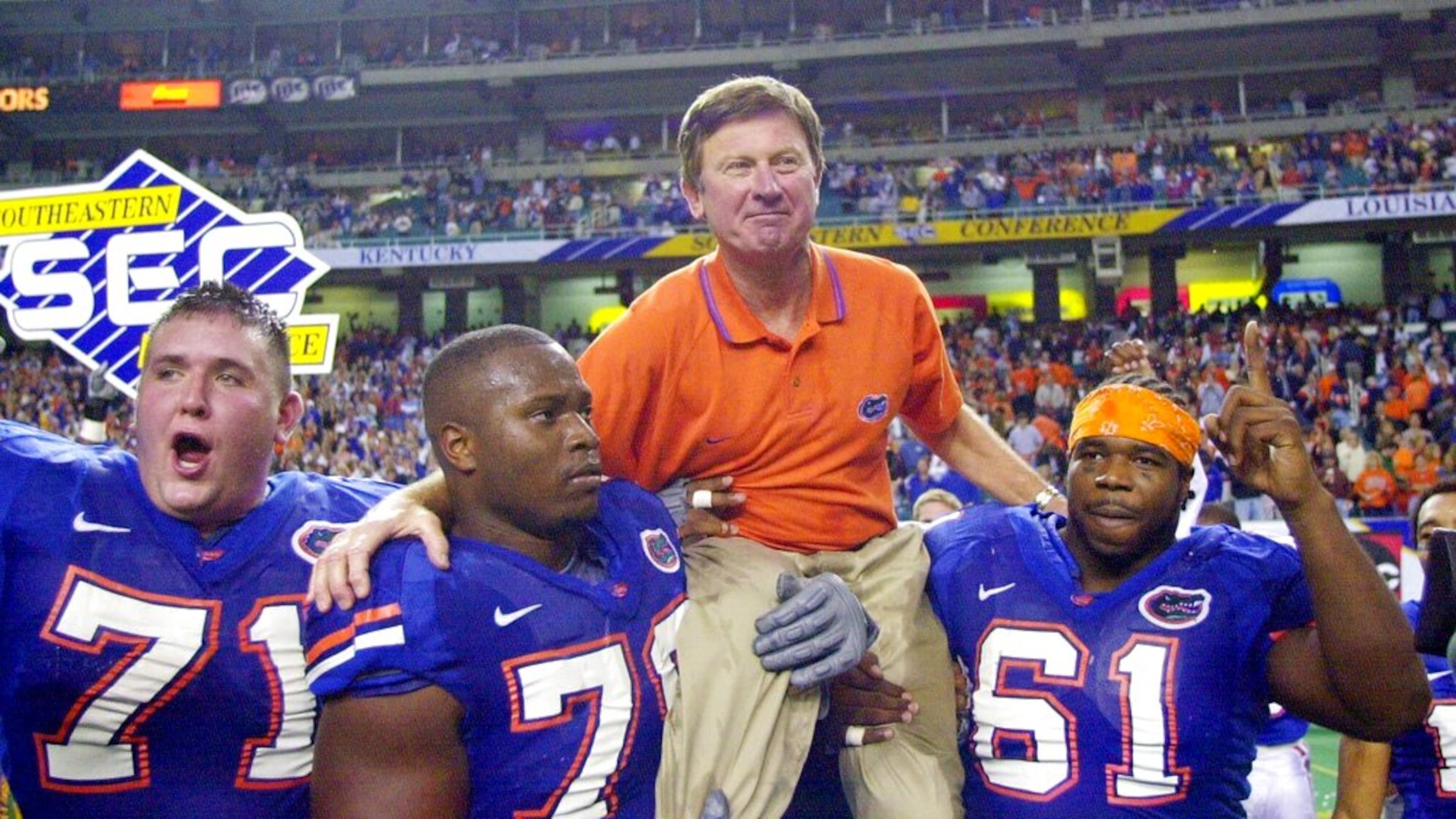 In this Dec. 2, 2000, file photo, Florida head coach Steve Spurrier is carried off the field after the Gators downed Auburn 28-6 in the SEC Championship at the Georgia Done in Atlanta. (John Bazemore/AP)