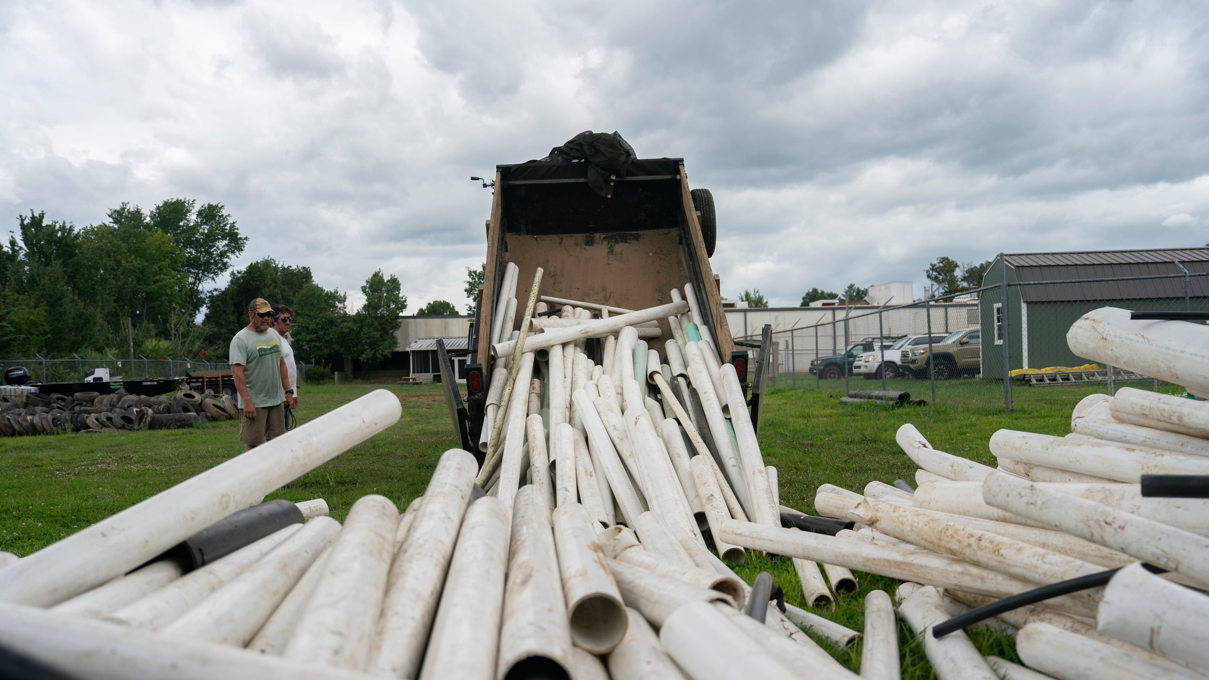 IPEX PVC pipe cleared from the riverbank is dumped at MountainTrue headquarters Wednesday, July 22, 2026, in Alexander, N.C. (AP Photo/Allison Joyce)
