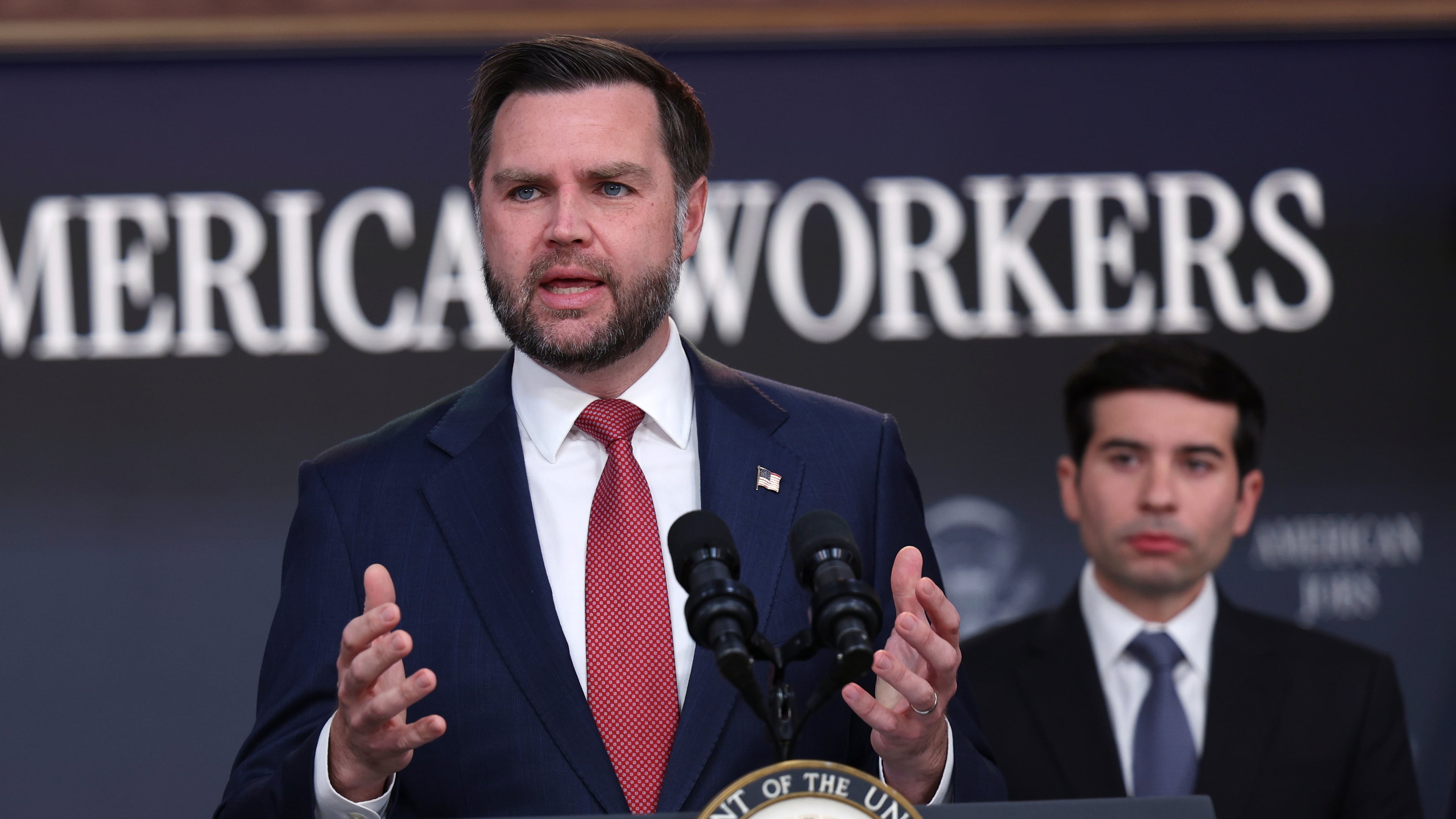 Vice President JD Vance speaks as Labor Secretary Keith Sonderling listens during a news conference on the Fraud Task Force inside the Eisenhower Executive Office Building on the White House campus, Thursday, Oct. 8, 2026, in Washington. (AP Photo/Tom Brenner)