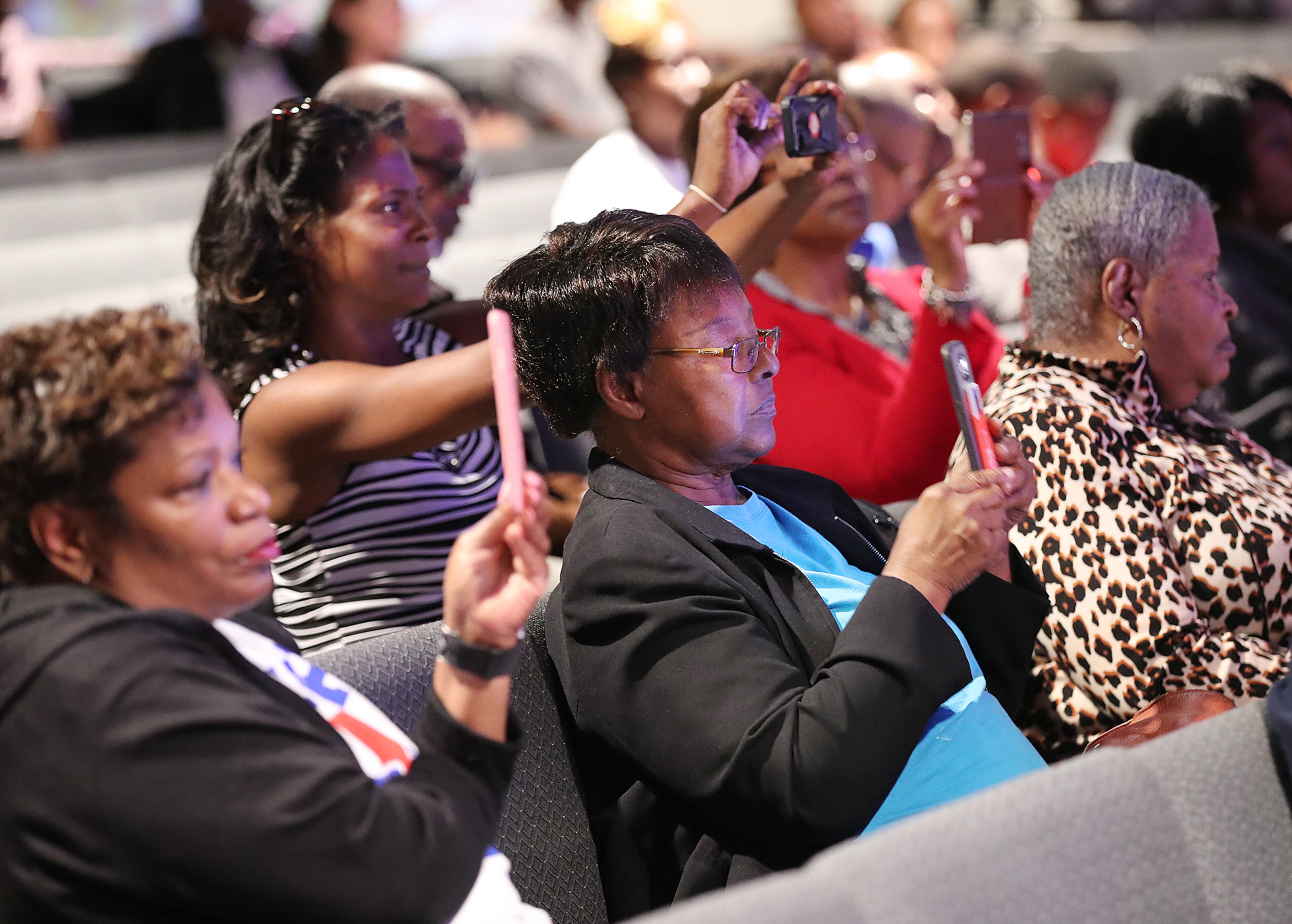 Members of the audience record Gov. Nathan Deal's discussion about the Opportunity School District referendum on their phones during a forum at Impact Church on Tuesday, Oct. 25, 2016, in East Point. Curtis Compton /ccompton@ajc.com