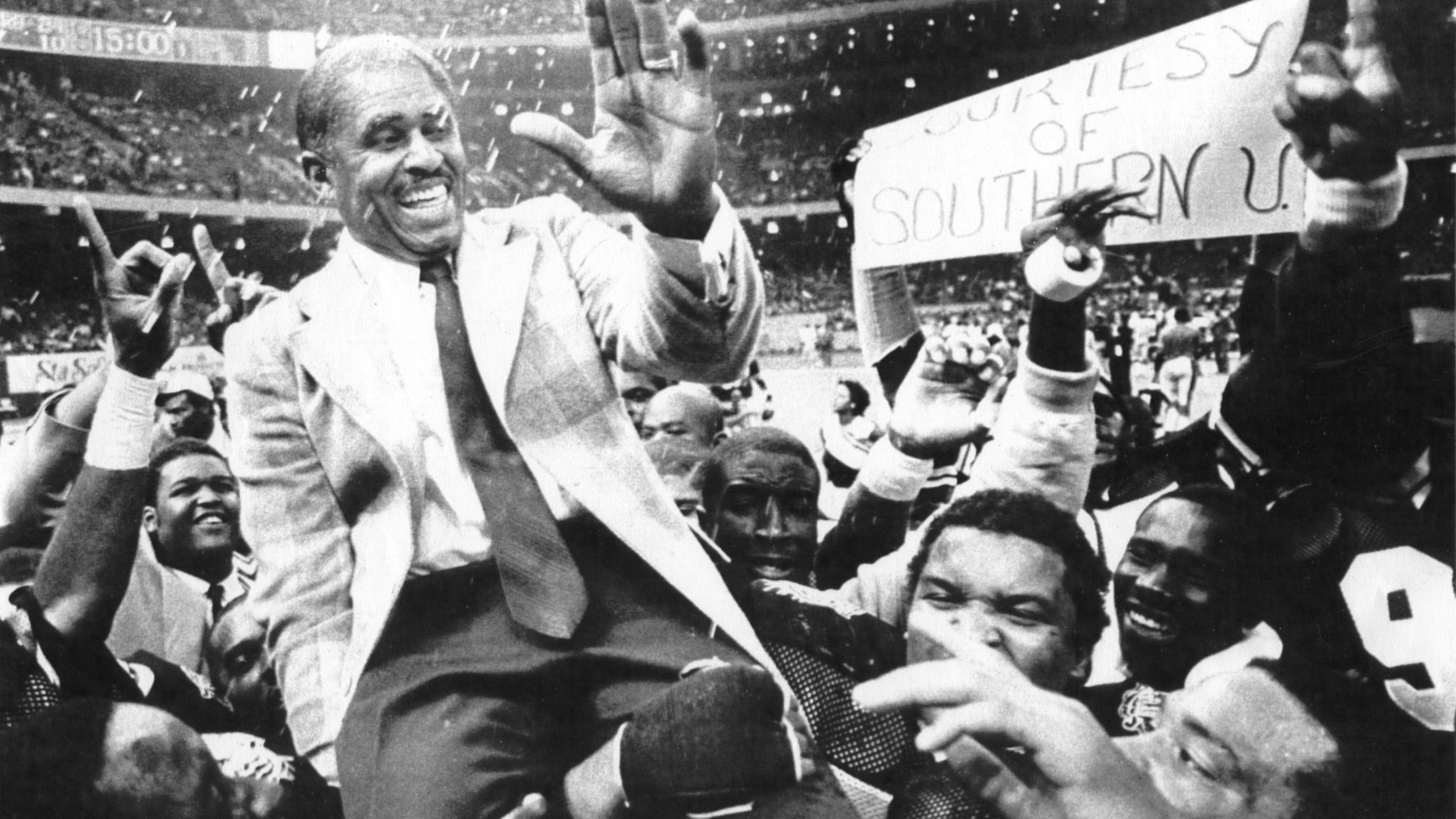 Grambling State University head coach Eddie Robinson is carried off the field after the Tigers defeated Southern University 24-10 in the 1983 Bayou Classic. Robinson ended his career in 1997 with 408 wins. (UPI photo)