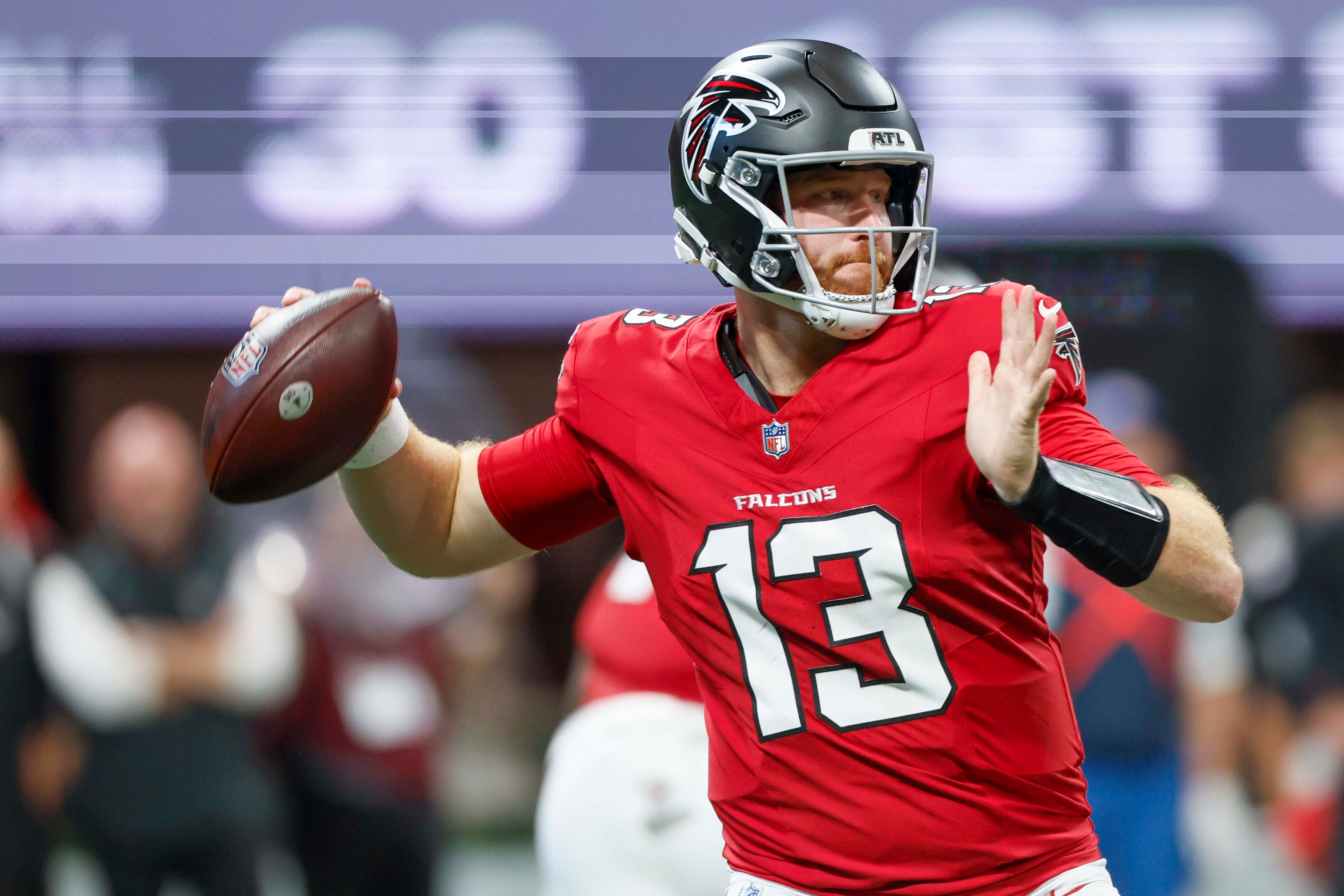 Atlanta Falcons quarterback Cooper Rush (13) attempts a pass in the first half of an NFL game against the Carolina Panthers at Mercedes-Benz Stadium in Atlanta on Sunday, September 20, 2026. (Miguel Martinez/AJC)