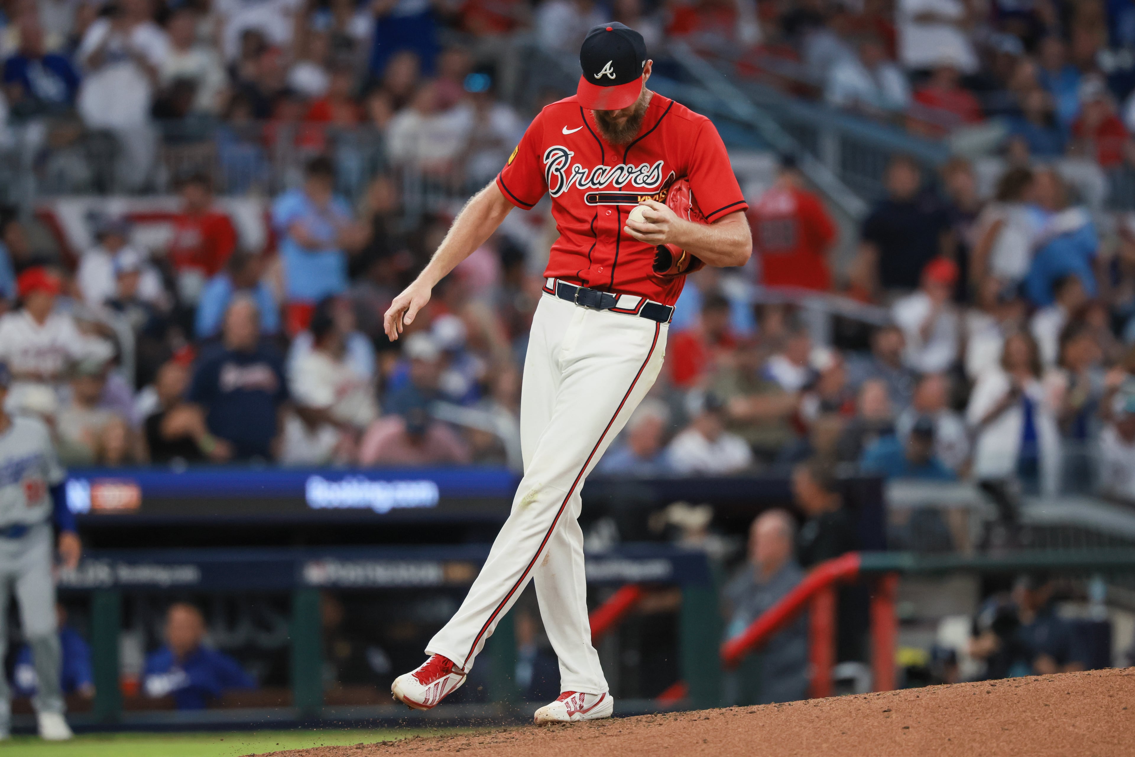 Atlanta Braves pitcher Chris Sale (51) reacts after giving up a two-run home run to Los Angeles Dodgers third baseman Enrique Hernández (8) during the fourth inning of Game 3 of the MLB National League Division Series between the Atlanta Braves and the Los Angeles Dodgers, Tuesday, Oct. 6, 2026, in Atlanta. (Jason Getz/AJC)
