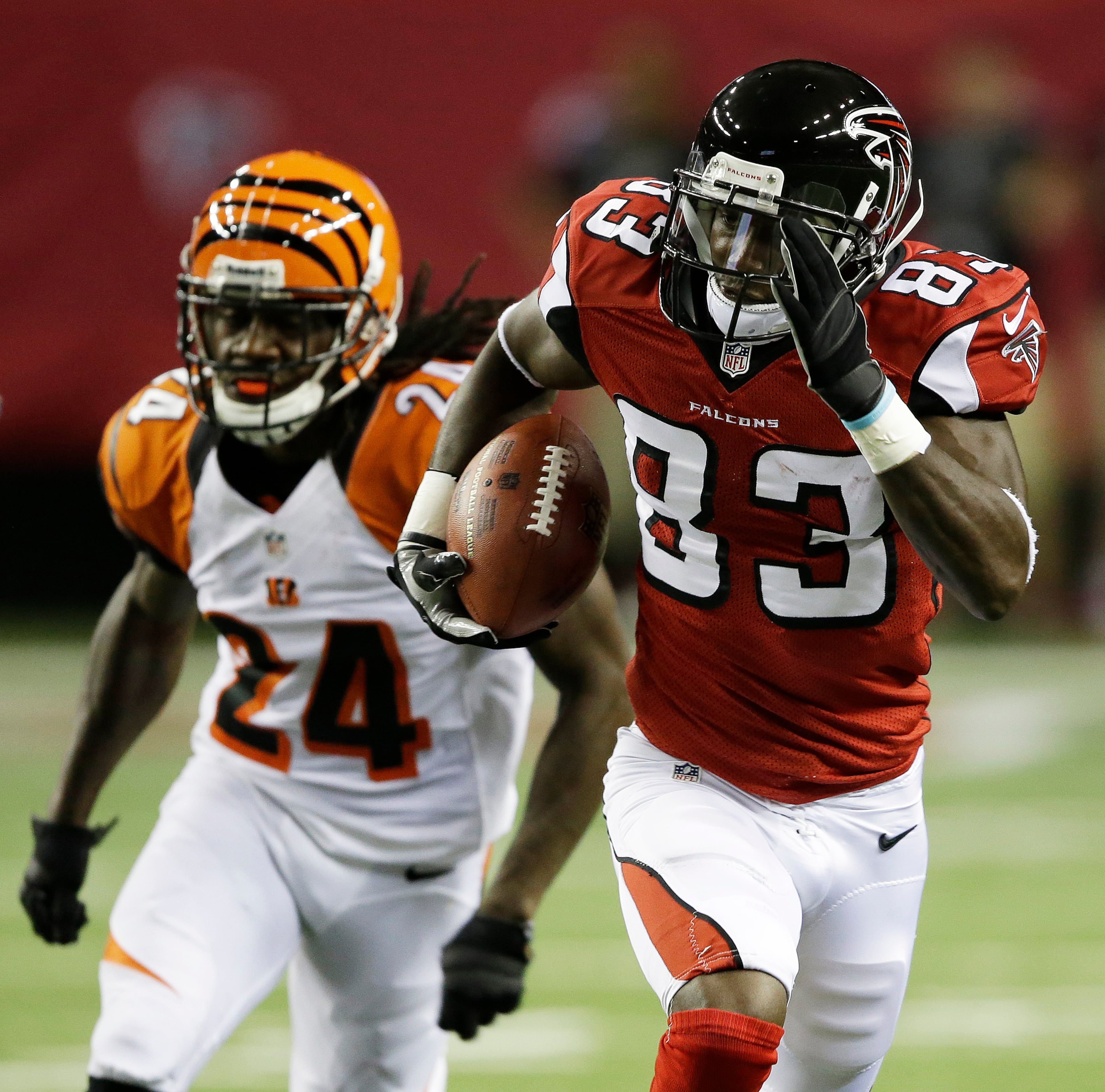 Atlanta Falcons wide receiver Harry Douglas (83) runs up field against Cincinnati Bengals cornerback Adam Jones (24) during the first half of a preseason NFL football game.