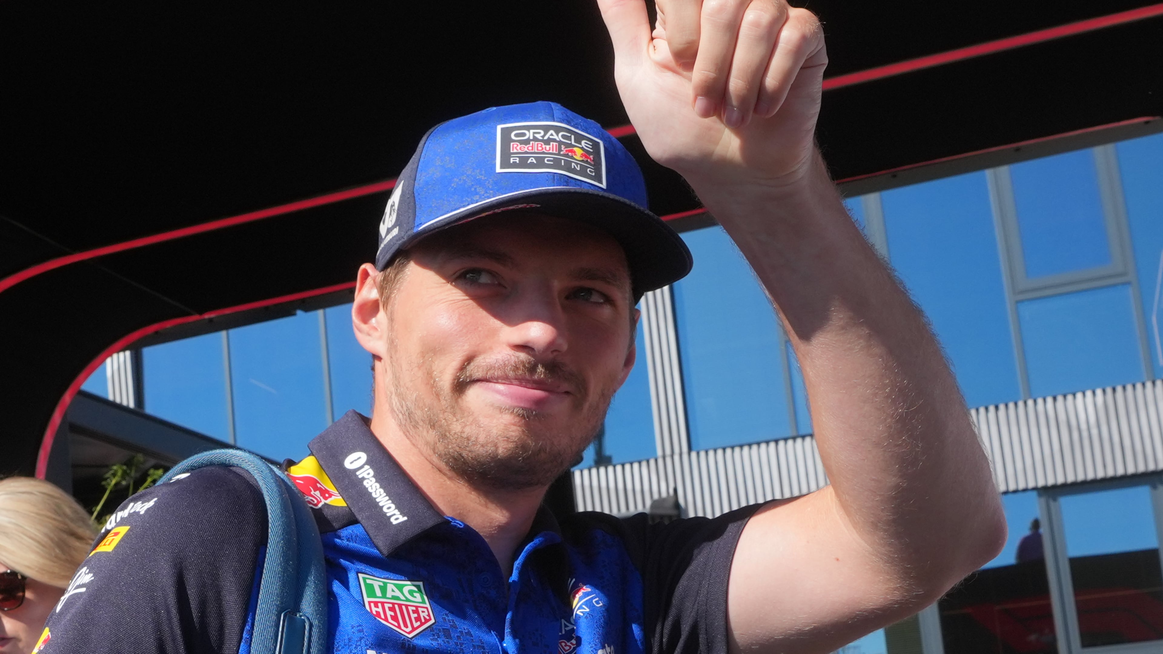 Red Bull driver Max Verstappen of the Netherlands gives a thumbs up to fans as he arrives in the paddock prior to the first free practice ahead of Sunday's Italy Grand Prix, at the Monza racetrack, Italy, Friday, Sept. 4, 2026. (AP Photo/Luca Bruno)