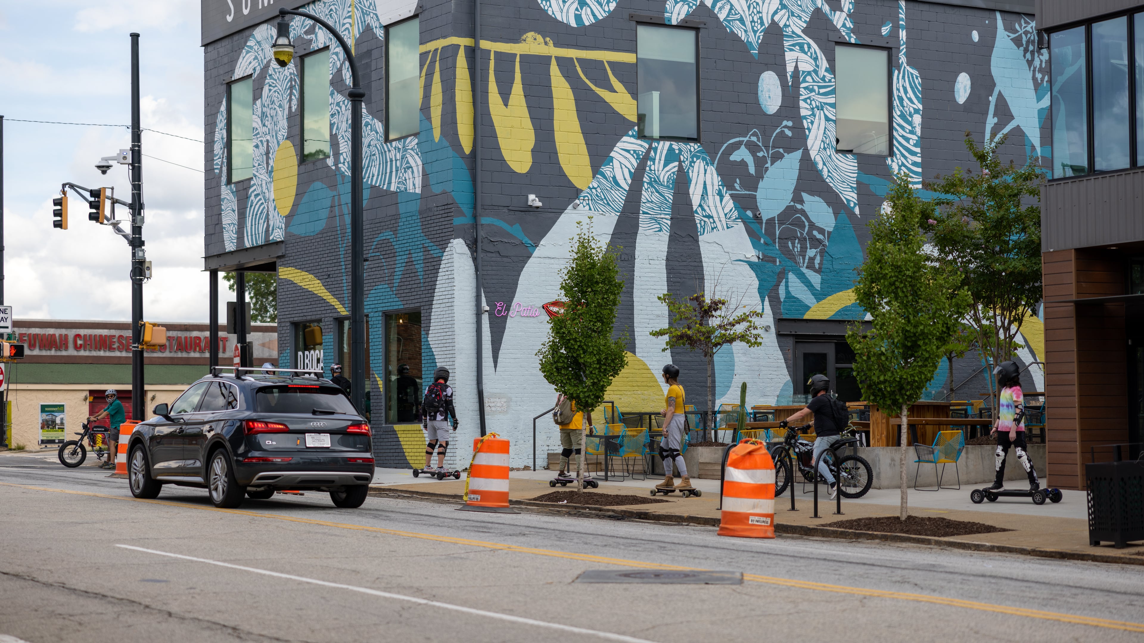 People riding electric skateboards in Summerhill on August 20, 2022