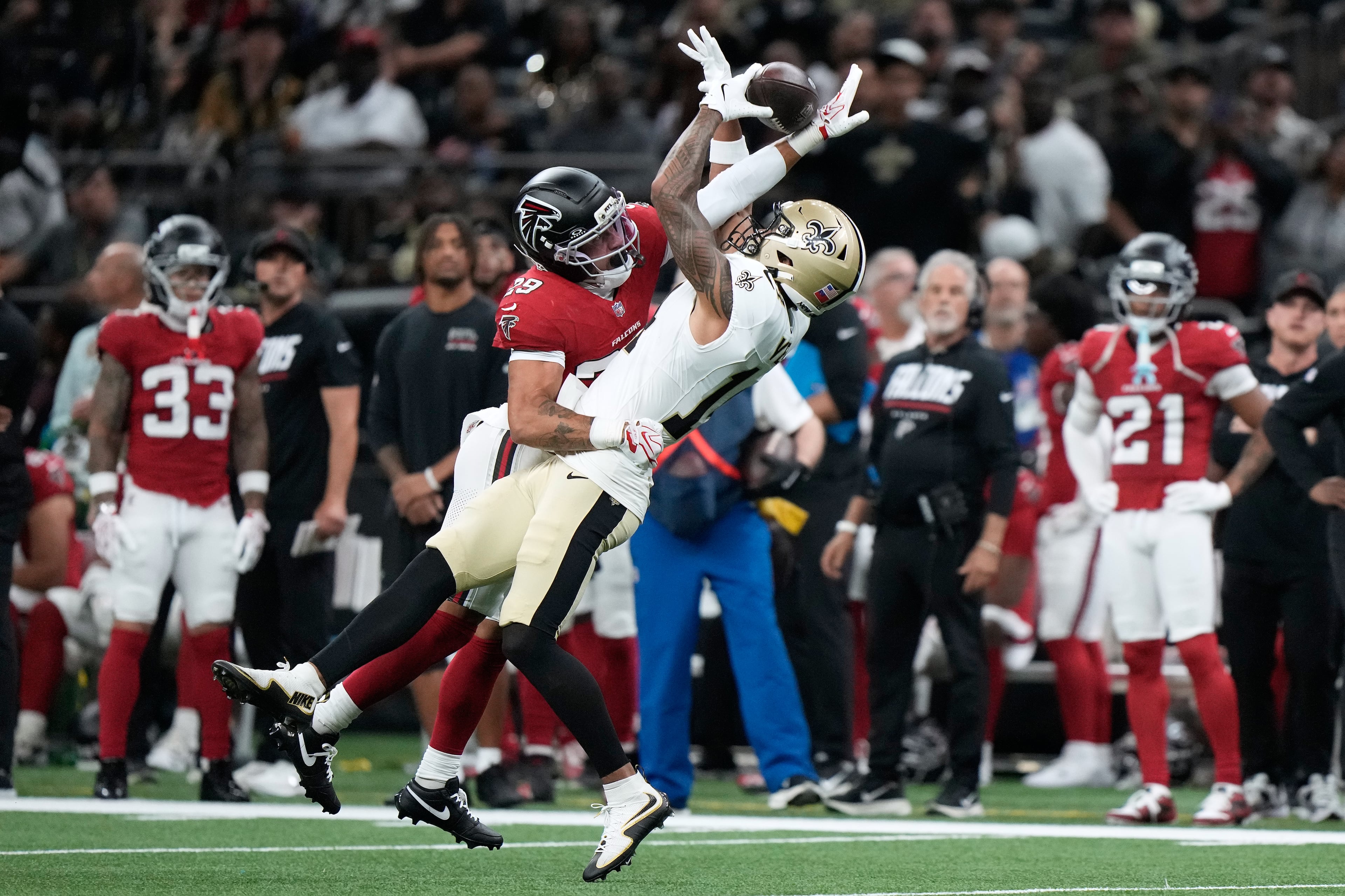 Atlanta Falcons safety Sydney Brown (center left) breaks up a pass intended for New Orleans Saints wide receiver Devaughn Vele during the first half of an NFL football game in New Orleans, Monday, Oct. 5, 2026. (Gerald Herbert/AP)