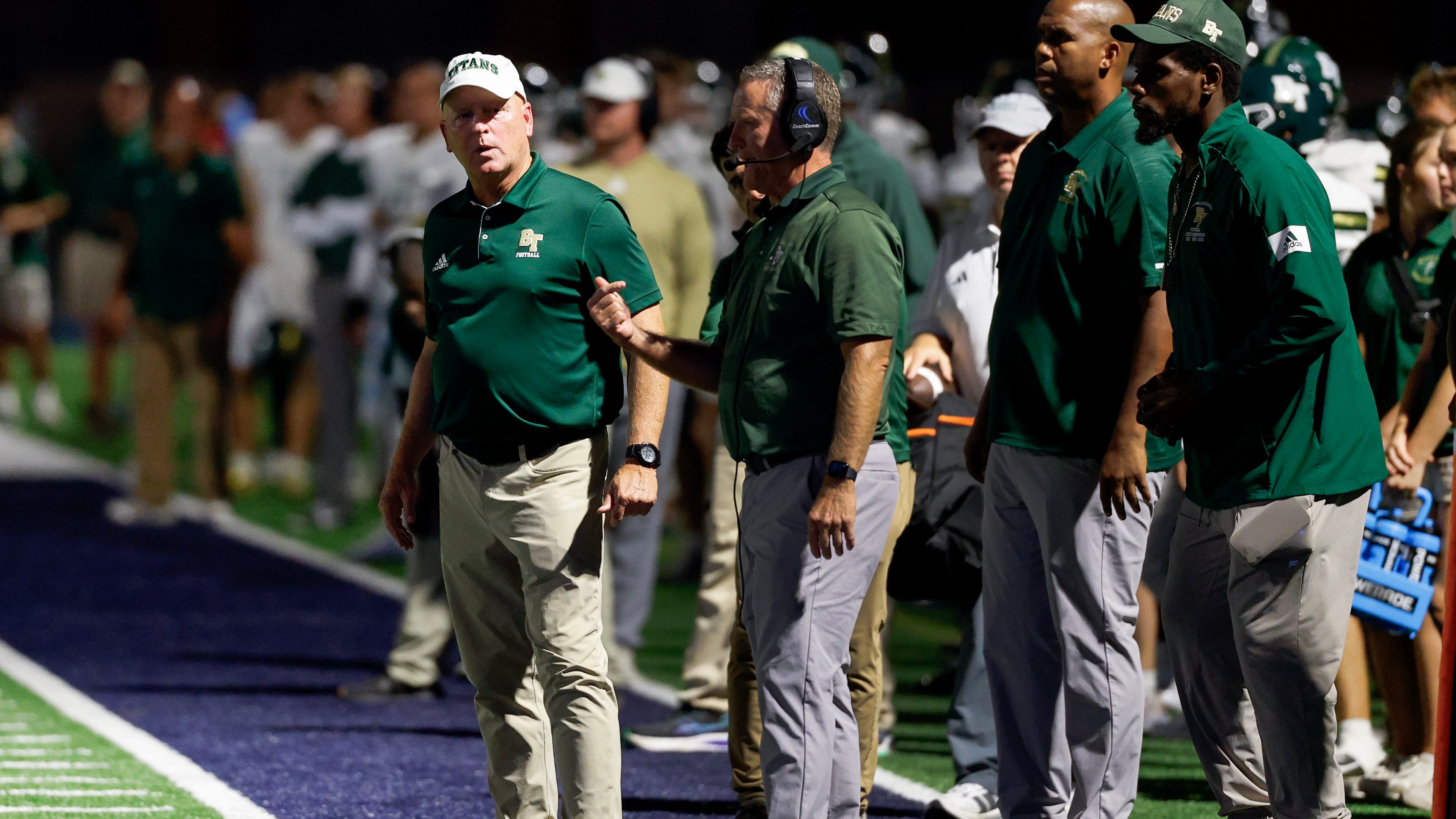 Blessed Trinity head coach Ed Dudley, left, during the first half a high school football game between Blessed Trinity and Marist, Friday, Sept. 25, 2026, in Atlanta. (Erik S. Lesser for the AJC)