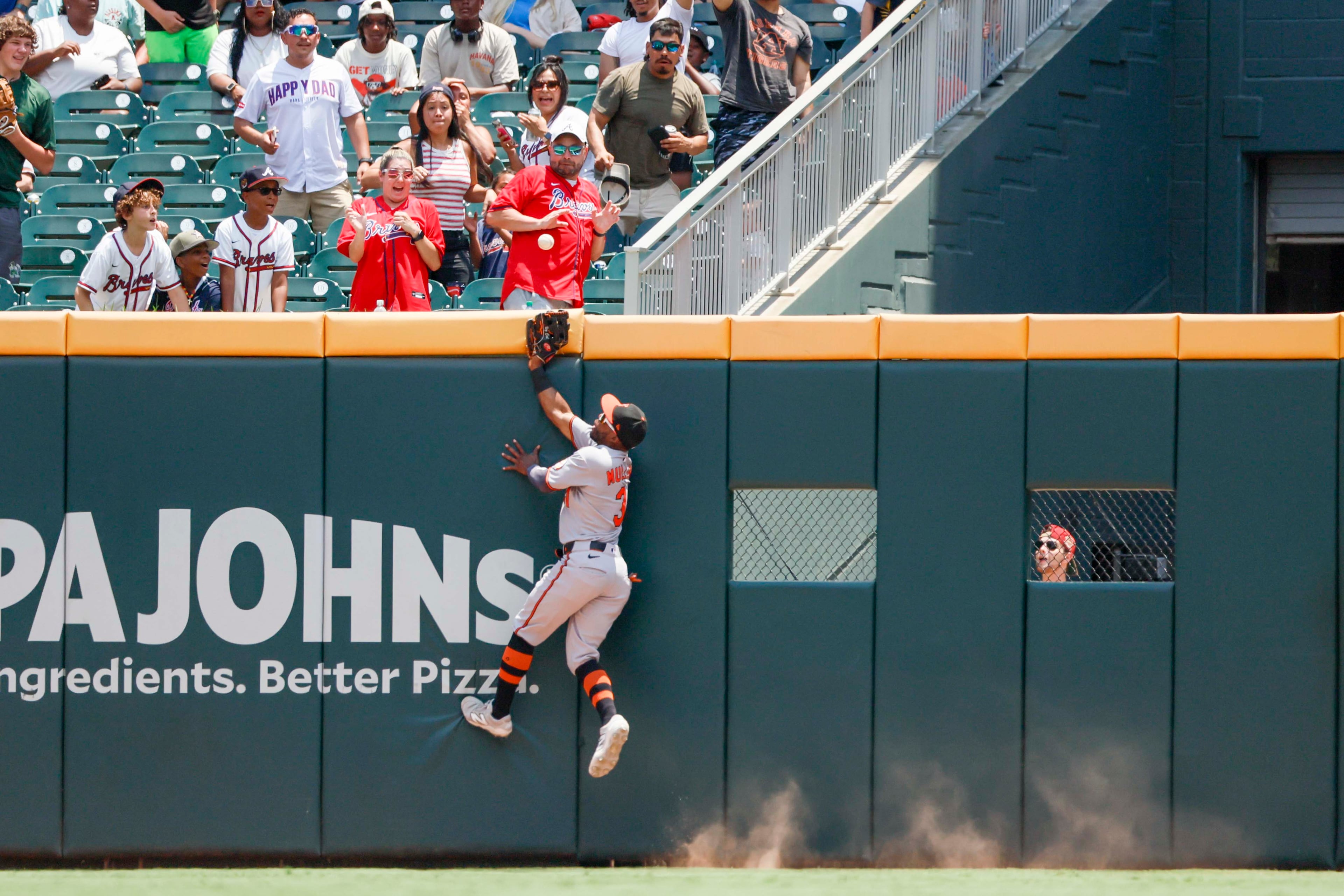 Baltimore Orioles outfielder Cedric Mullins (31) is unable to grab the ball after Atlanta Braves outfielder Atlanta Braves catcher Sean Murphy (12) hit a solo home run during the ninth inning against the Baltimore Orioles at Truist Park on Sunday, July 6, 2025, in Atlanta.
(Miguel Martinez/ AJC)