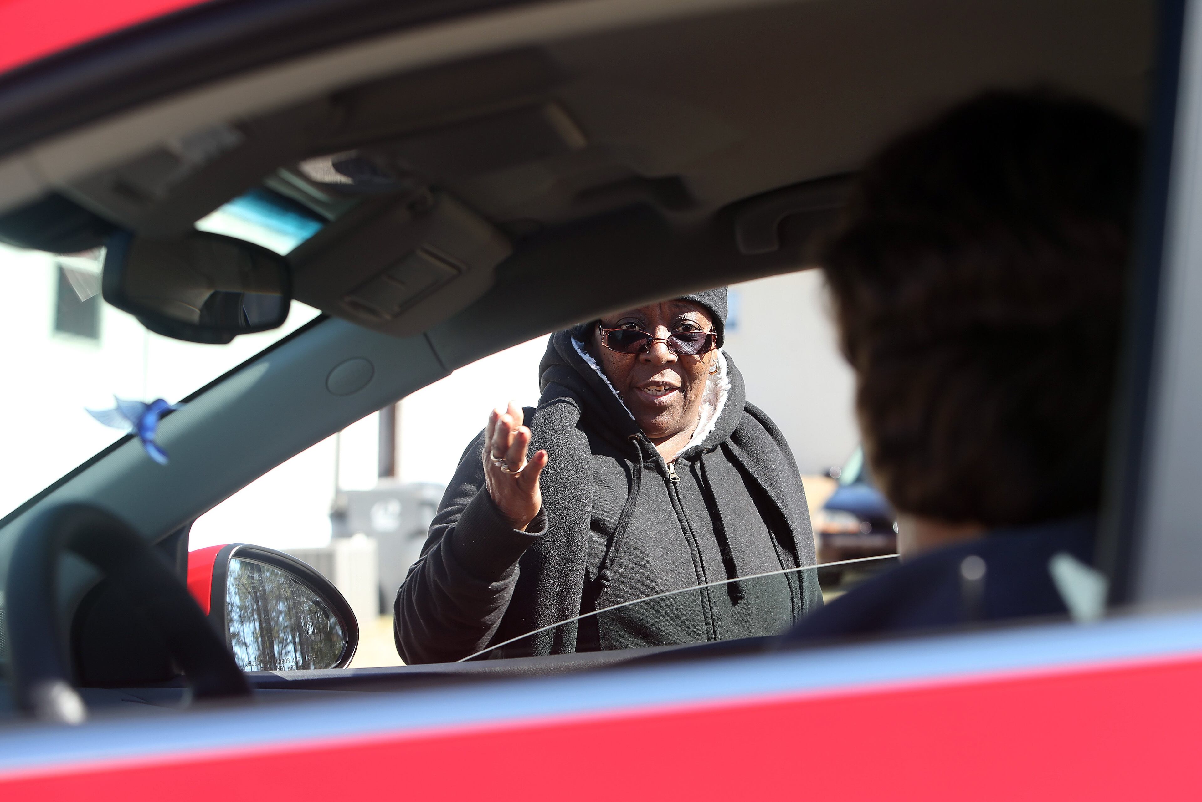 Grovetown resident Henrietta Wearrien talks with coworkers who stopped to check on her Saturday afternoon February 15, 2014. Wearrien was upset that she still didn't have power even though many other areas around Augusta had been restored. BEN GRAY / BGRAY@AJC.COM