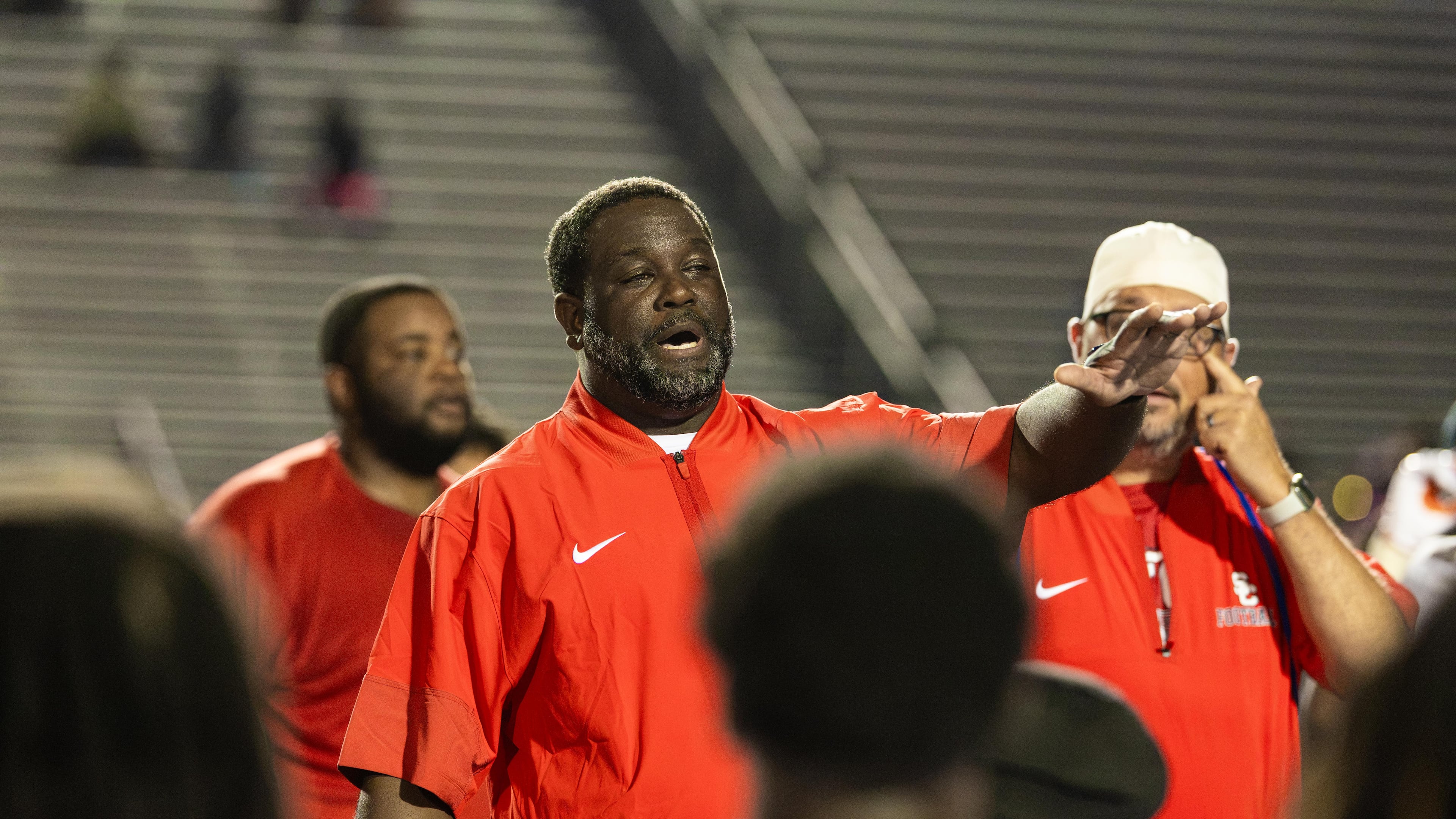 Sandy Creek head coach Darius Smiley addresses the team after the Patriots won 21-0 against Douglas County on Friday, Aug. 28, 2026. (Oscar Guevara Saenz for the AJC)