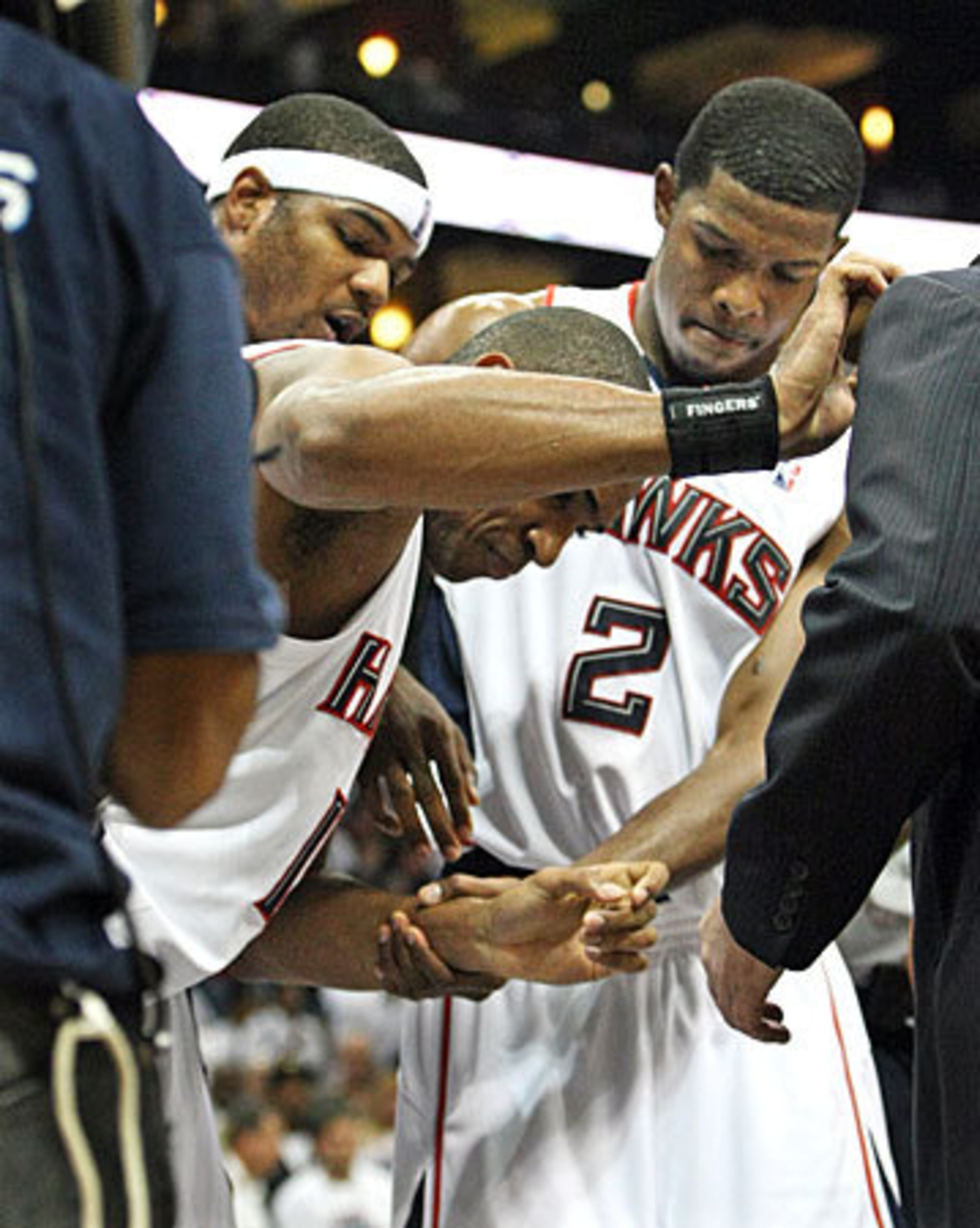 Josh Smith and Joe Johnson helped Horford off the floor.