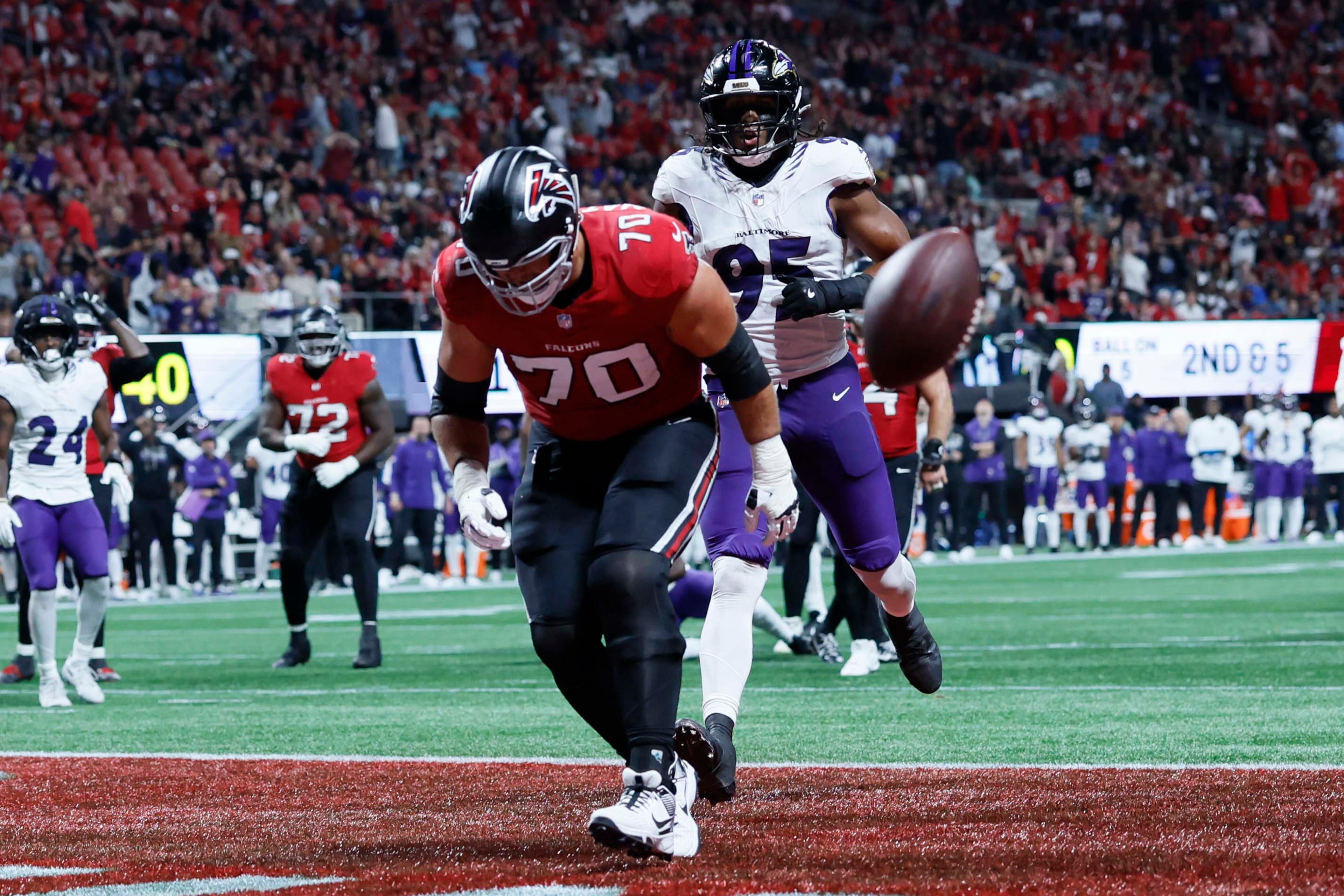 Atlanta Falcons offensive tackle Jake Matthews (70) was unable to make a catch for a touchdown during the first half of a football game against the Baltimore Ravens at Mercedes-Benz Stadium in Atlanta, GA, on Sunday, Oct. 11, 2026. (Miguel Martinez/AJC)