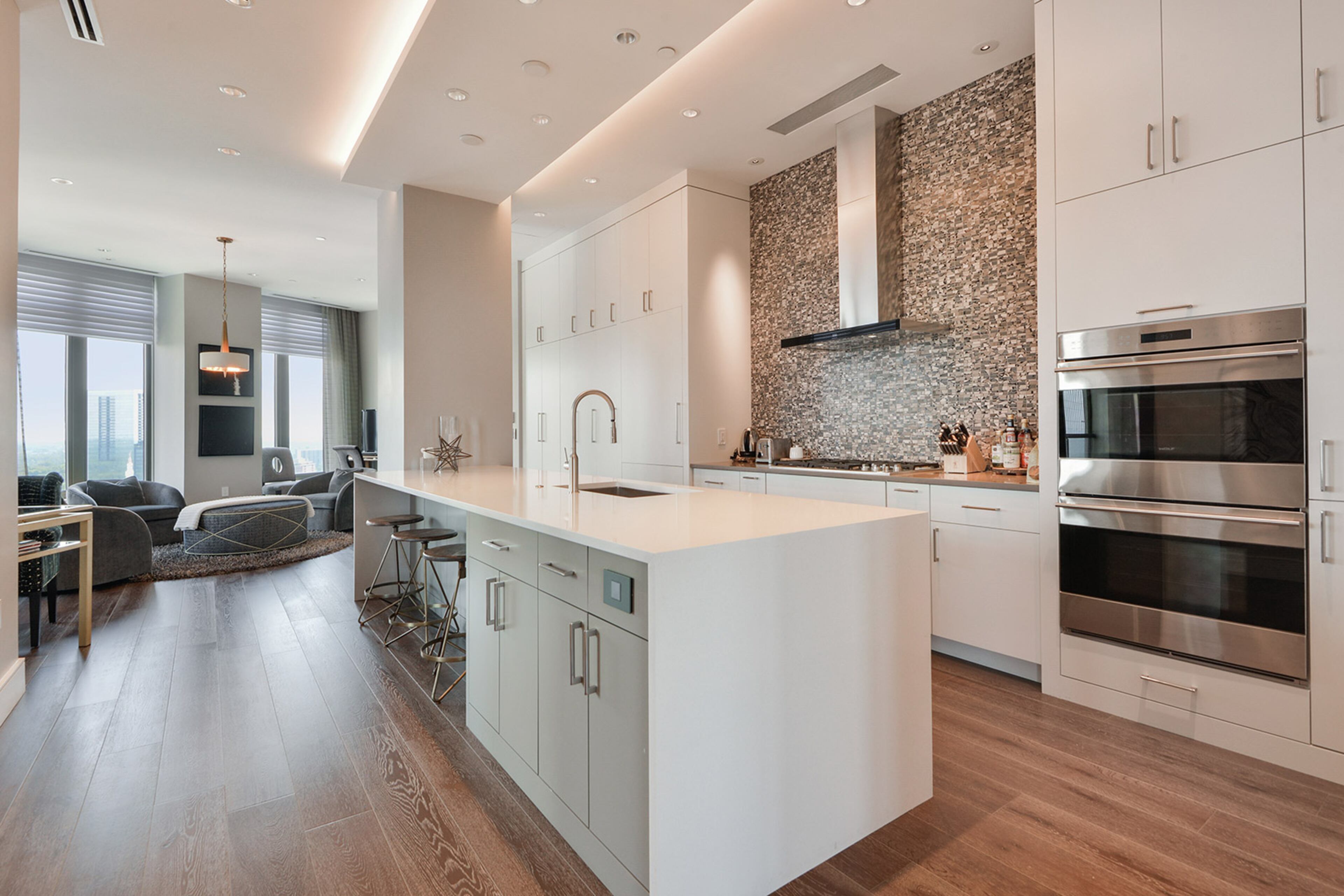 The kitchen features a gas cooking and hidden walk-in pantry.